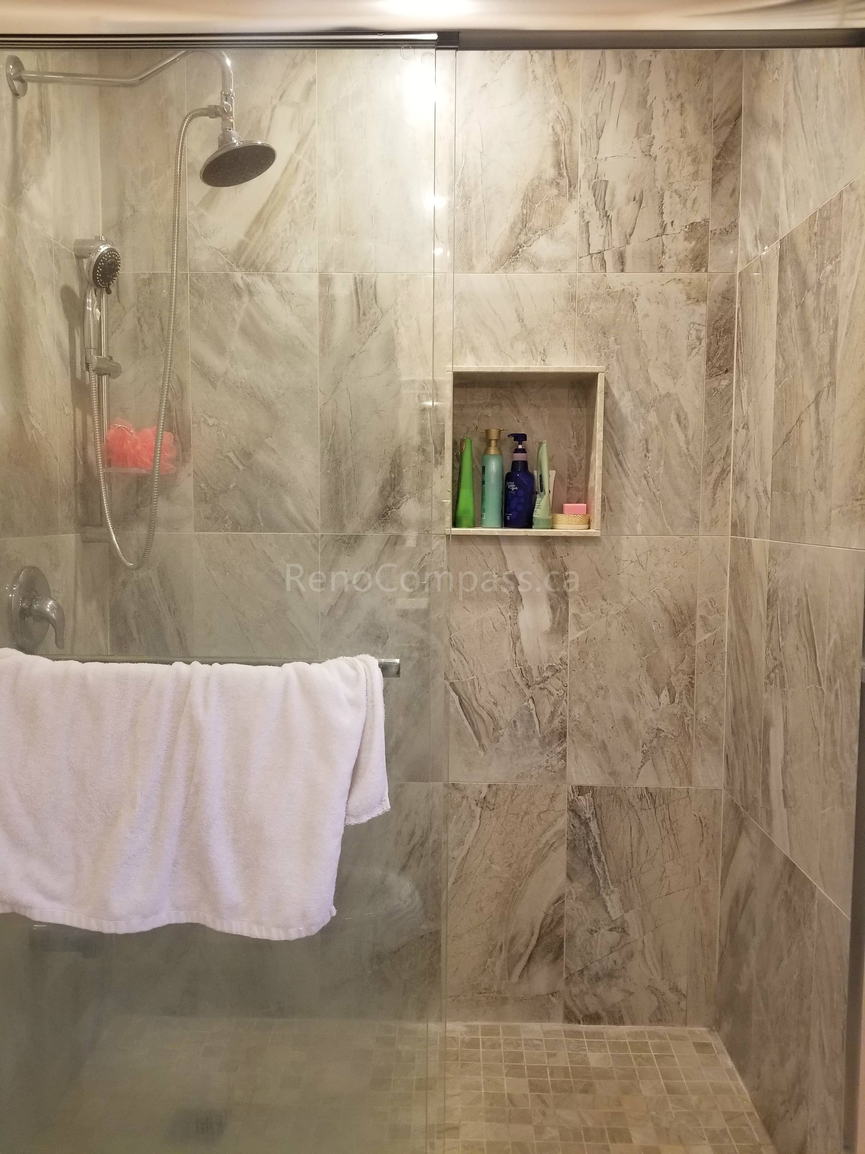 This Markham bathroom renovation features newly installed shower wall tiles with a built-in recessed niche for convenient storage. The modern tile design enhances both functionality and visual appeal, providing a clean, elegant finish that is easy to maintain. As part of a full bathroom upgrade including new flooring, shower, and vanity, the space now offers improved comfort, durability, and a contemporary look for everyday use.