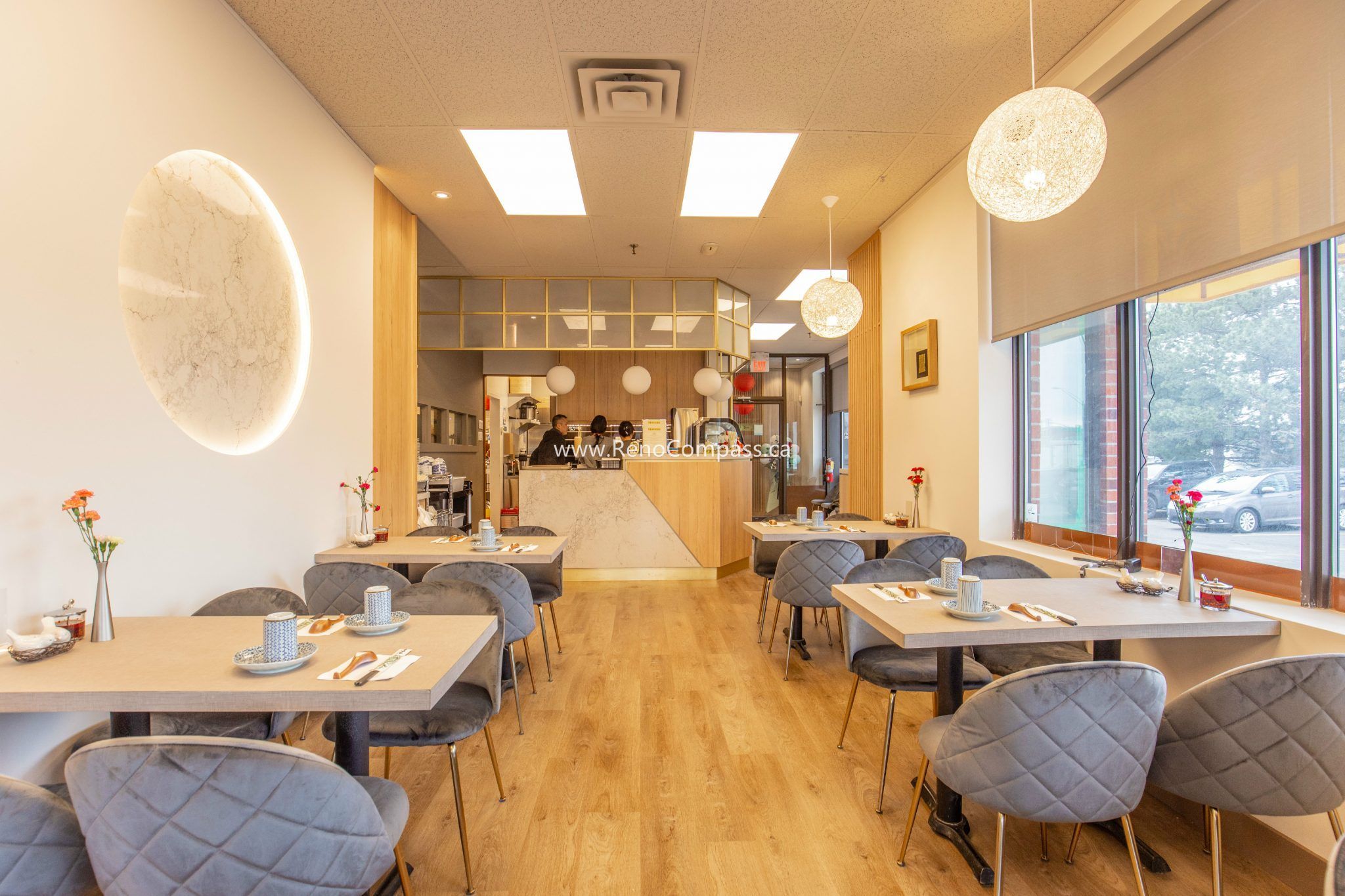 This Richmond Hill Chinese restaurant renovation completed by Toronto renovation company Reno Compass Inc. showcases a bright and modern dining space designed for comfort and efficiency. The upgraded interior features warm wood flooring, custom wall finishes, elegant pendant lighting, and contemporary seating arrangements that enhance the overall dining experience. With a carefully planned layout and refined aesthetic details, the renovation creates a welcoming atmosphere for guests while improving functionality and flow for daily restaurant operations.