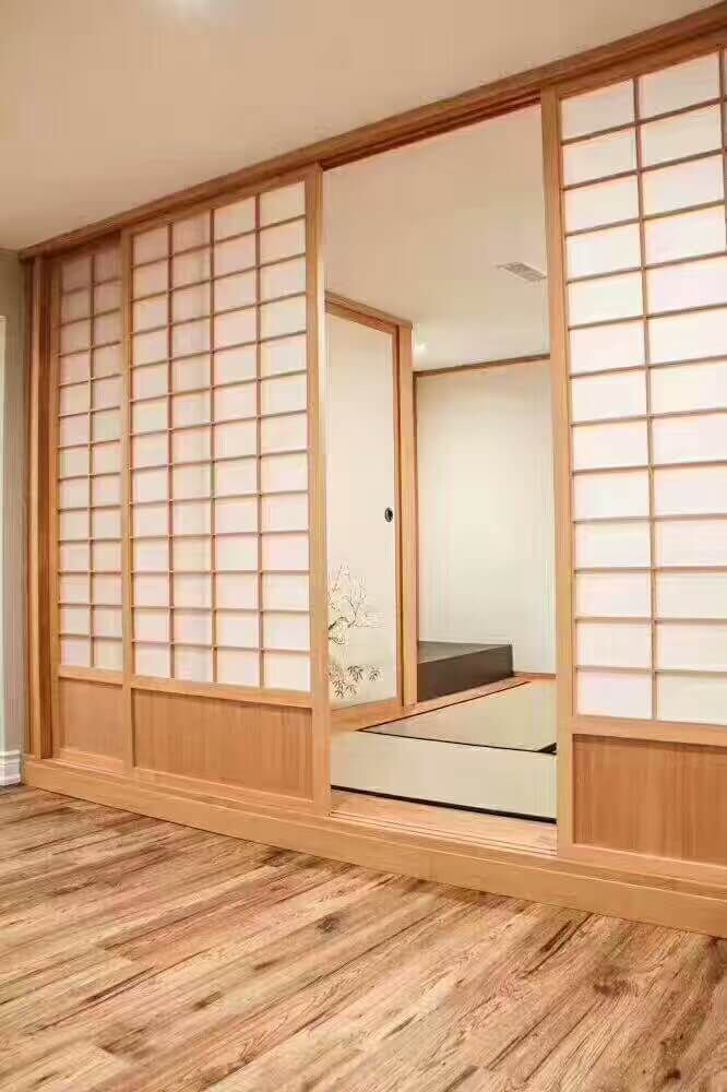 This Markham interior renovation features a custom Japanese-style tatami room designed for relaxation and cultural living. The space includes traditional shoji sliding doors, natural wood framing, and a raised tatami platform that creates a serene and minimalist atmosphere. Warm wood flooring and soft neutral tones enhance the calming aesthetic while maintaining modern functionality. This unique room addition blends traditional Japanese design with contemporary home renovation standards, completed by a professional Toronto renovation contractor specializing in custom interior spaces.