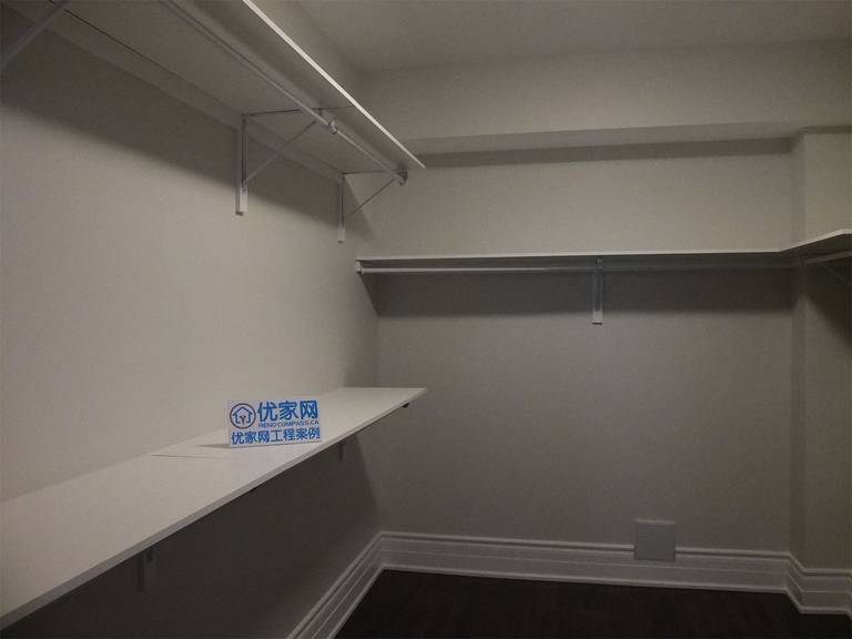This Richmond Hill basement renovation includes a functional walk-in closet designed with custom shelving and hanging rods for efficient storage. The clean layout maximizes space utilization, making it ideal for organizing clothing, seasonal items, or additional household storage in the basement.