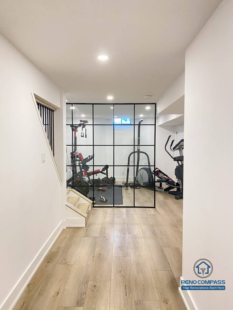 This basement gym room provides a dedicated home fitness space with a clean, modern design. Durable finishes and efficient lighting make it ideal for daily workouts as part of this Markham basement renovation.