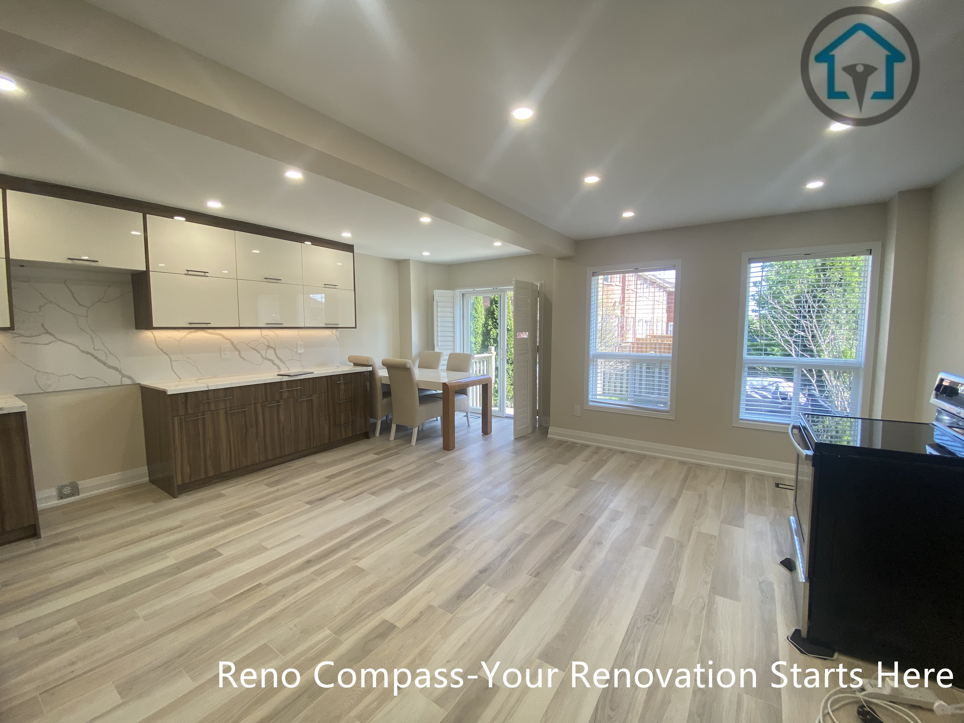 Open concept living and dining area from a completed interior renovation project in Vaughan, featuring a bright layout and seamless connection between spaces by Reno Compass.