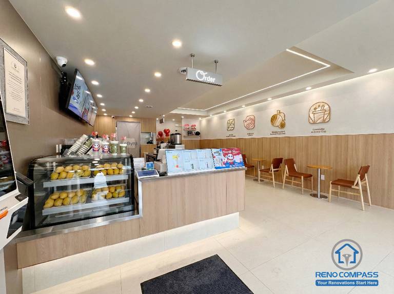 This North York bubble tea shop renovation features a modern service counter, digital menu display, and efficient ordering layout designed for high customer traffic. Completed by a professional Toronto renovation company, the commercial interior combines clean finishes, warm lighting, and functional workflow to enhance both customer experience and daily store operations.