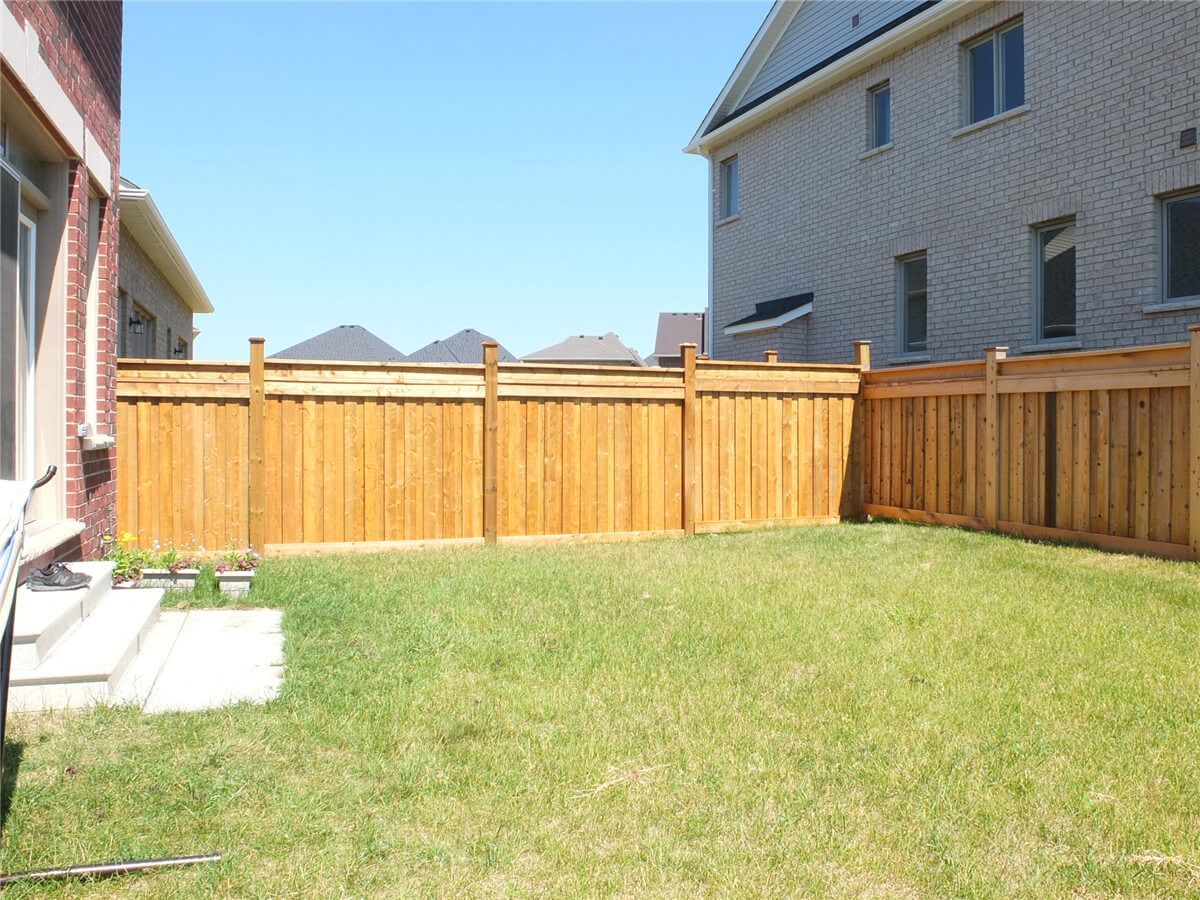 Newly installed wooden privacy fence for a detached home in Aurora. This backyard fence replacement project improves security, privacy, and overall curb appeal with durable pressure-treated wood panels and clean alignment. Completed by a professional Toronto Renovation Company.