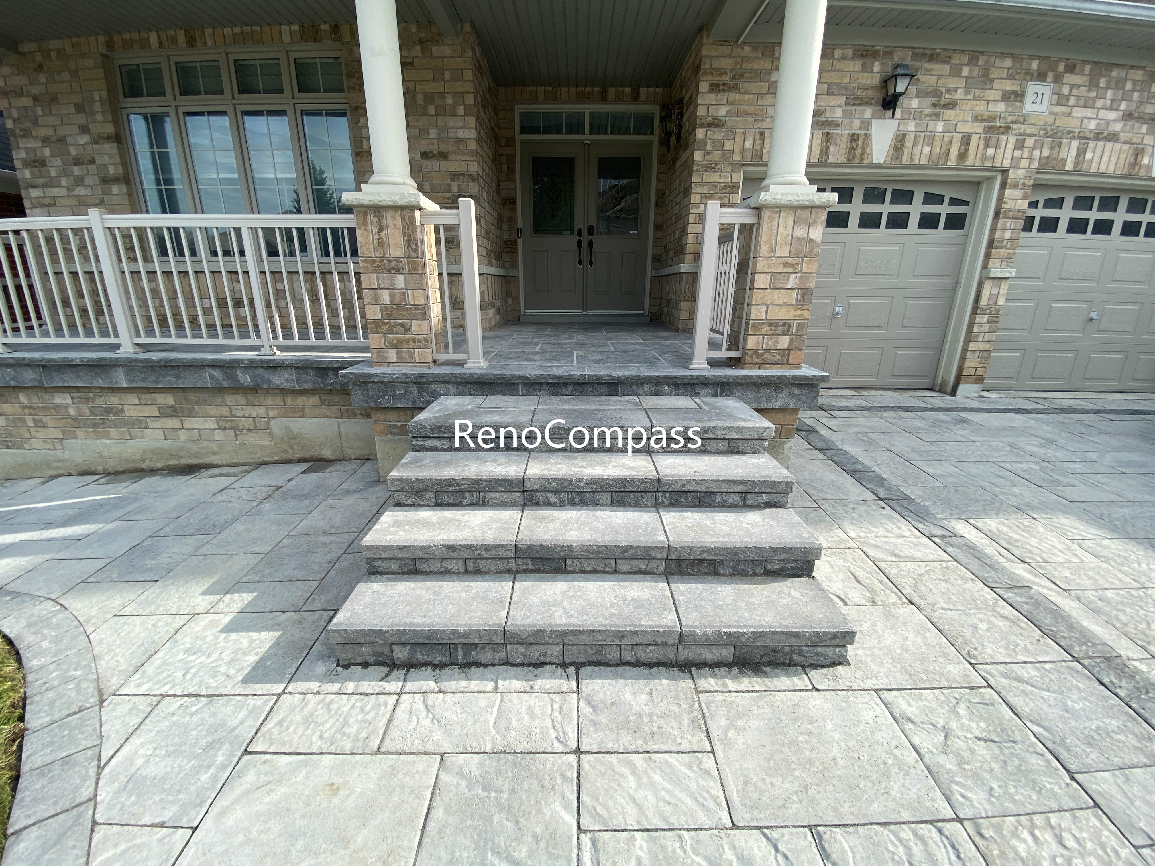 This Aurora front entrance renovation features professionally built interlocking steps paired with a seamless walkway design. Large-format concrete pavers and stone steps are precisely aligned to ensure structural stability, safe elevation changes, and long-term durability. The neutral grey tones complement the home’s exterior while creating a clean and welcoming entrance. Integrated step design improves accessibility and visual flow from the driveway to the front porch, enhancing curb appeal and everyday functionality for residential properties in Aurora.