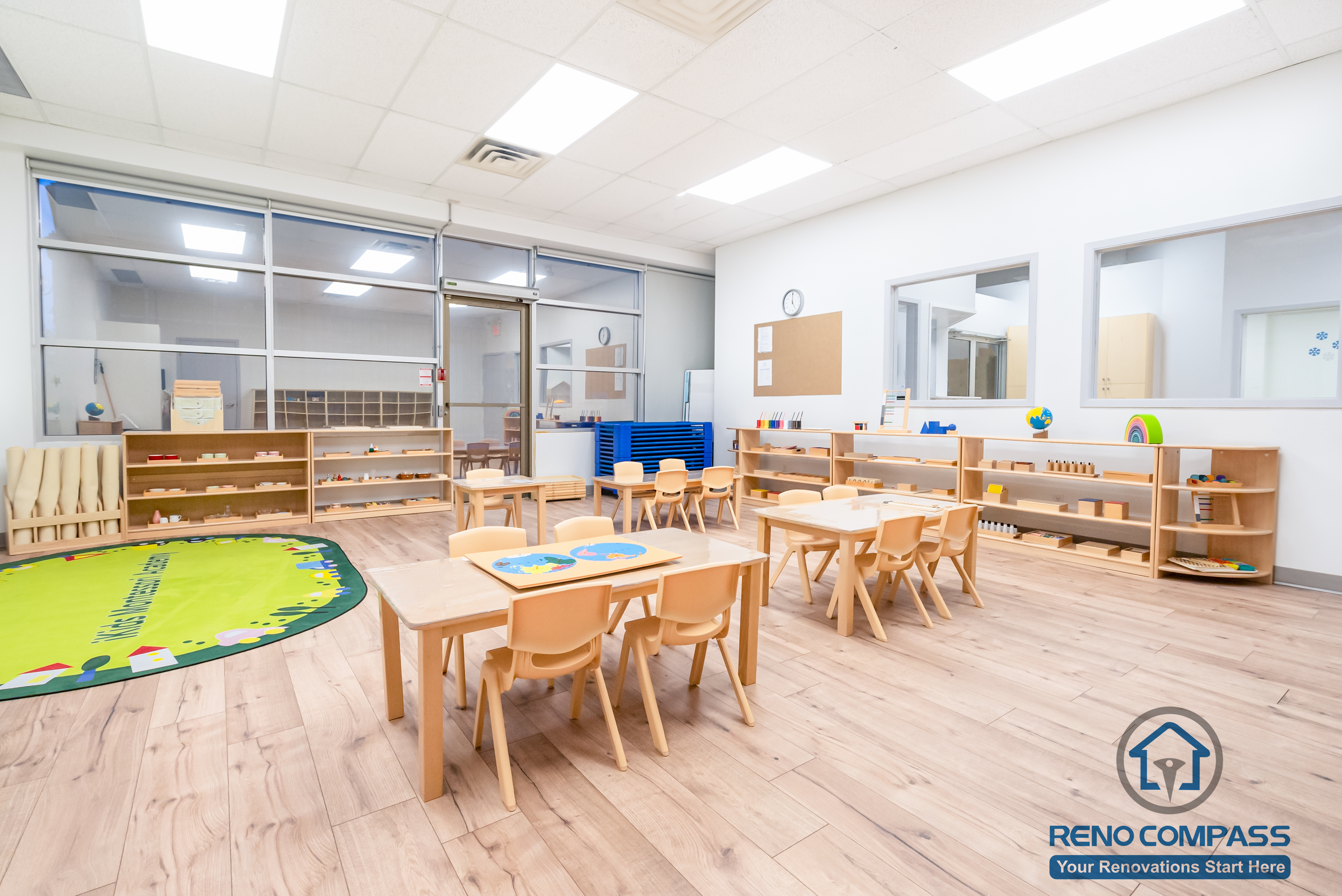 This Markham daycare renovation showcases a spacious classroom learning area designed to support group activities, early education, and daily routines. Child-sized tables and chairs are arranged to encourage collaboration while maintaining clear circulation for supervision. Open shelving and low-height cubbies provide organized storage that promotes independence and easy access for children. Durable, slip-resistant flooring and bright overhead lighting ensure safety, comfort, and long-term usability. Completed by a Toronto renovation company, Reno Compass Inc., this daycare interior renovation reflects a thoughtful balance of educational functionality, safety compliance, and efficient space planning for modern childcare environments.
