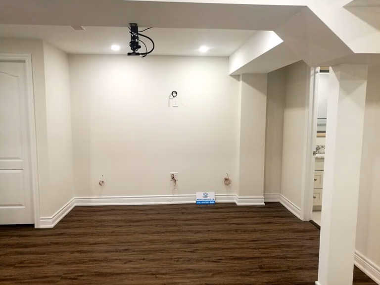 This finished basement renovation in Markham showcases a spacious open-concept layout designed for flexibility and everyday comfort. The renovation features high-quality vinyl flooring, modern recessed lighting, structural column refinishing, and a bright neutral color palette that enhances the sense of space. A newly upgraded basement bathroom and multiple storage areas improve functionality, creating a versatile lower level suitable for family living, recreation, or guest use. Completed by a trusted Toronto renovation company, this project highlights practical design and clean craftsmanship for modern homes.