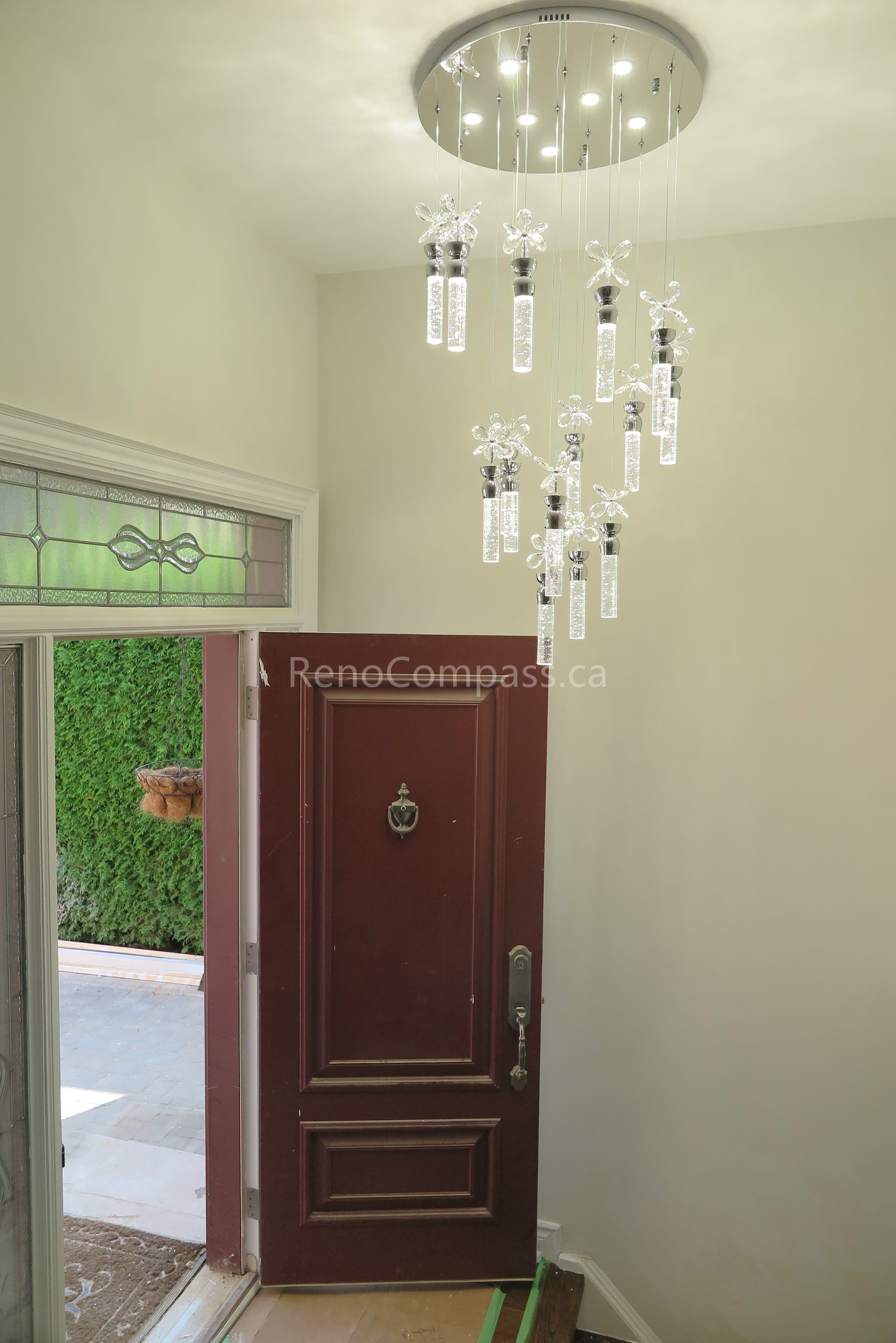 This North York interior renovation highlights a newly installed modern crystal chandelier enhancing the home’s front entryway. The upgrade elevates the vertical space with elegant lighting design, creating a welcoming and sophisticated first impression. Completed by a trusted Toronto renovation company, Reno Compass focuses on refined details, improved lighting ambiance, and a cohesive interior transformation throughout the home.