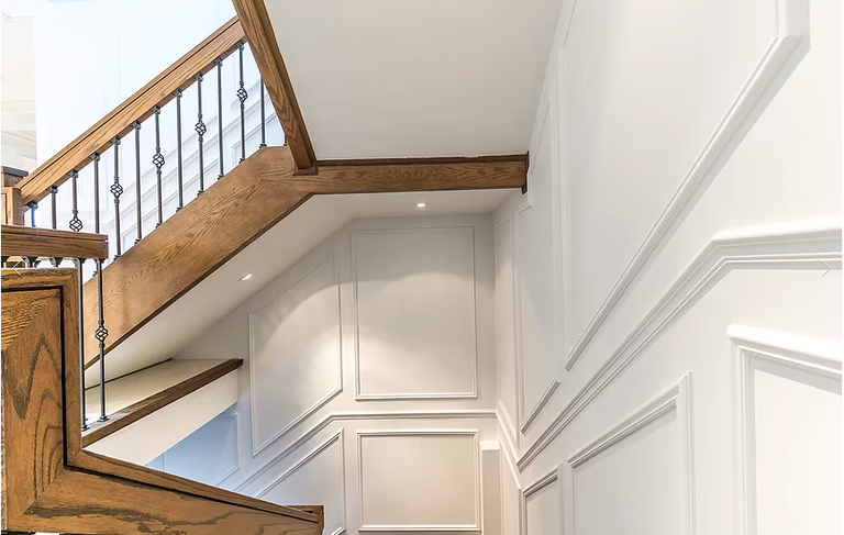 This Richmond Hill interior renovation showcases a bright hallway featuring custom wall paneling, refined trim work, and cohesive flooring transitions. The space reflects a timeless interior renovation approach that balances aesthetics, functionality, and circulation.