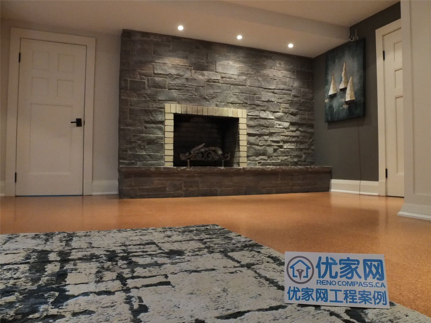 This Oakville basement renovation features a striking stone fireplace feature wall enhanced with recessed pot lighting and engineered flooring. The fireplace design adds warmth, texture, and visual focus to the basement living area, creating a cozy entertainment space for homeowners. Completed by a professional Toronto Renovation Company, the project combines natural stone finishes, balanced lighting, and thoughtful interior design to deliver a refined and inviting basement environment.