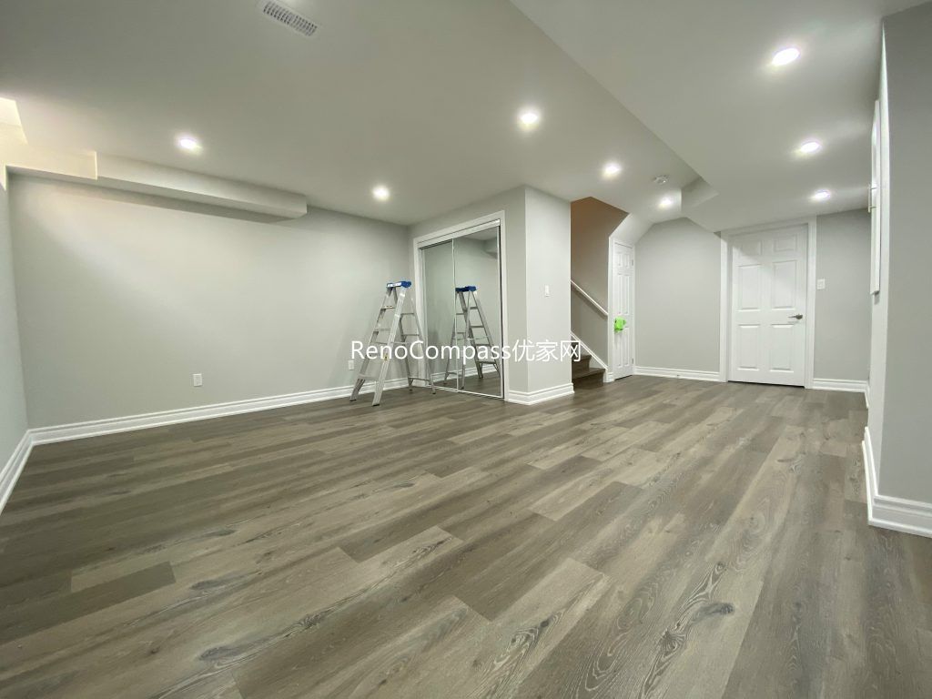 Modern Richmond Hill basement renovation with sleek flooring, crisp white trim, and soft neutral paint colors. Reno Compass delivered a clean, durable finish for long-term quality and comfort.