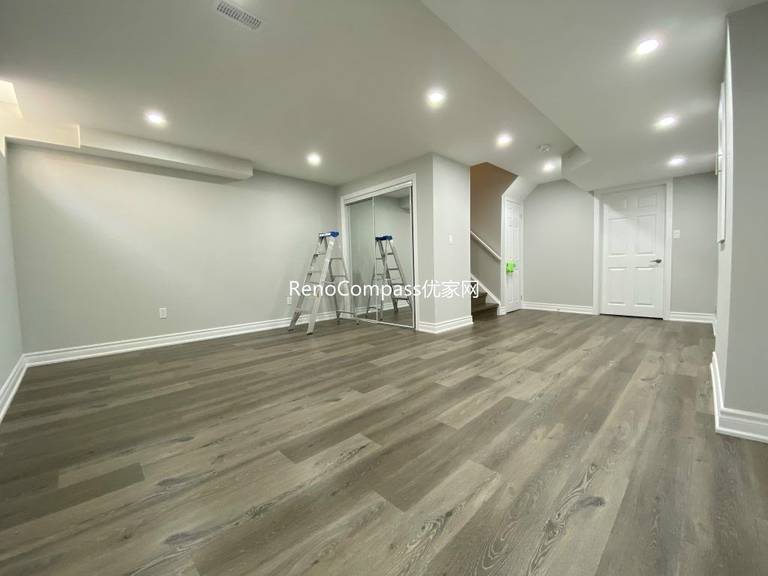 Modern Richmond Hill basement renovation with sleek flooring, crisp white trim, and soft neutral paint colors. Reno Compass delivered a clean, durable finish for long-term quality and comfort.
