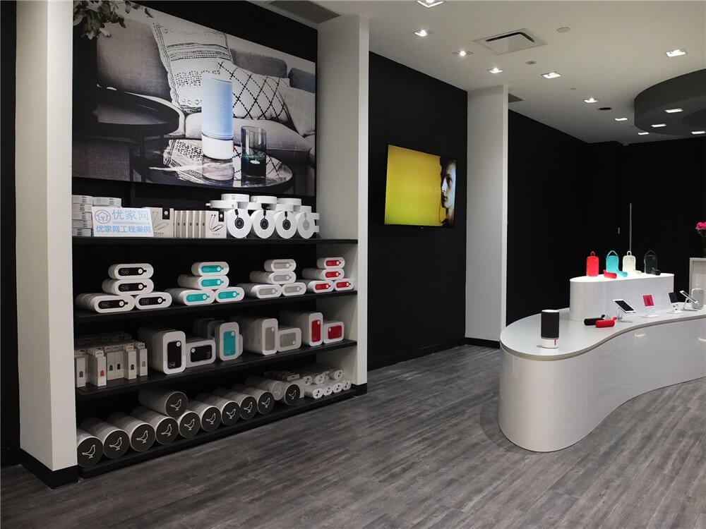 Commercial retail renovation inside Markville Mall featuring custom-built product display shelving, modern vinyl flooring, curved display counters, and clean black feature walls. The interior layout is designed to highlight products while maintaining an open and organized shopping environment. This retail renovation demonstrates how thoughtful store design and professional commercial construction can improve product visibility and create a modern shopping experience in a busy Toronto mall.