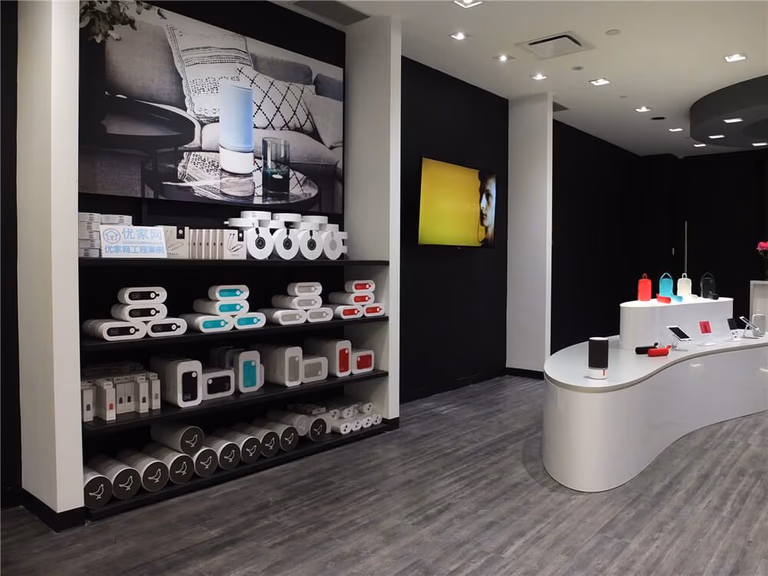 Commercial retail renovation inside Markville Mall featuring custom-built product display shelving, modern vinyl flooring, curved display counters, and clean black feature walls. The interior layout is designed to highlight products while maintaining an open and organized shopping environment. This retail renovation demonstrates how thoughtful store design and professional commercial construction can improve product visibility and create a modern shopping experience in a busy Toronto mall.