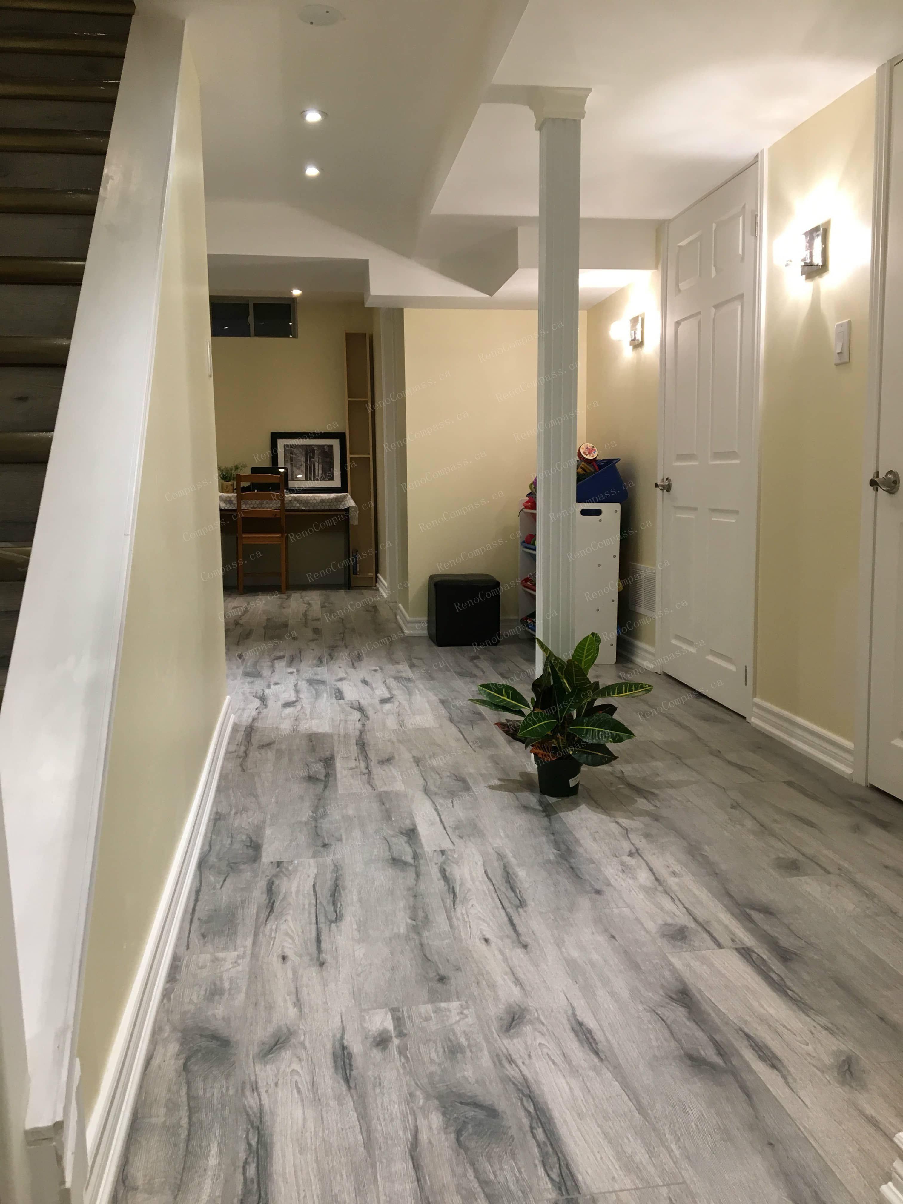 This Mississauga basement renovation showcases a newly upgraded hallway with durable modern flooring, recessed ceiling lights, and clean neutral finishes. Completed by a trusted Toronto renovation company, the refreshed basement layout improves flow, brightness, and functionality, creating a comfortable living environment ideal for a one-bedroom basement suite with bathroom.