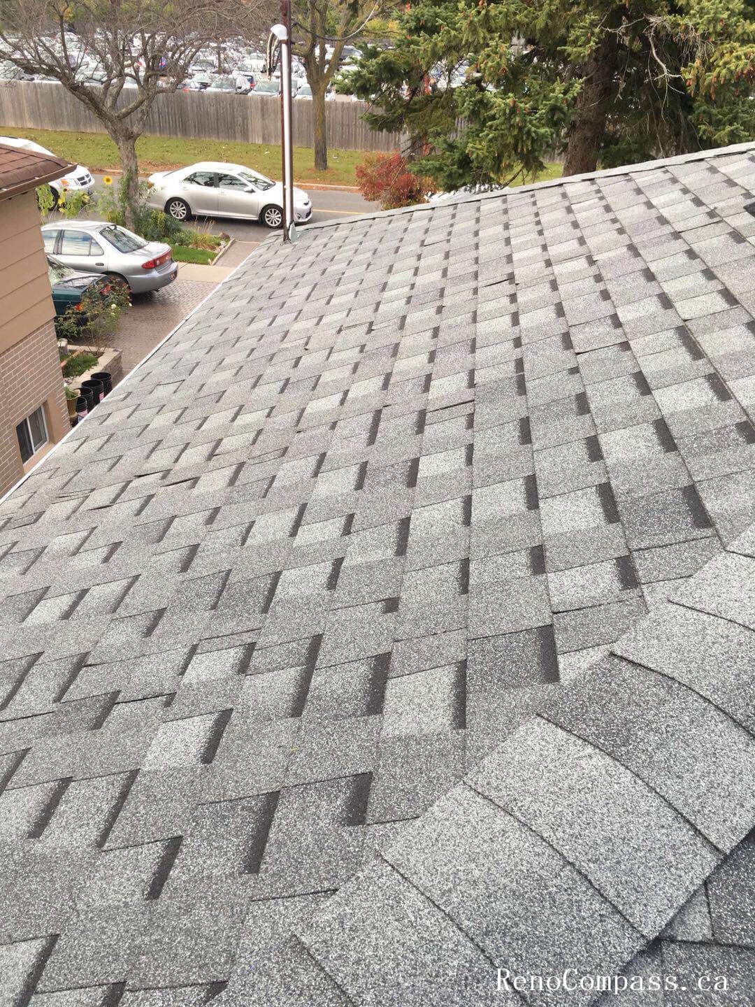 This image captures the mid-stage of a roofing replacement project in Toronto, showing newly installed roof decking and waterproof underlayment preparation. The old roofing materials have been removed to expose the wooden roof structure, allowing the team to reinforce the base and ensure proper alignment before installing new shingles. High-quality waterproof membrane layers are applied to enhance moisture protection and improve long-term durability against Toronto’s harsh weather conditions. This professional roofing replacement process ensures structural integrity, proper insulation support, and a reliable foundation for the final roofing system installation on residential properties.