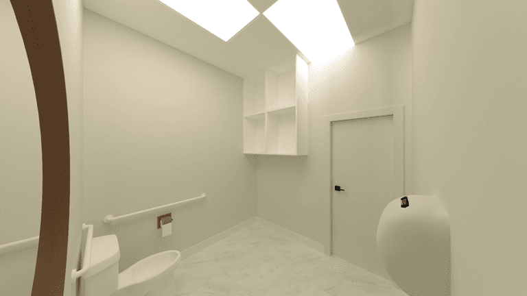 A clean and minimalist restroom inside a Waterloo claw machine arcade, designed with accessibility and practicality in mind. The space features barrier-free circulation, safety grab bars, built-in storage, and bright overhead lighting, ensuring comfort, hygiene, and compliance with commercial washroom standards within an entertainment venue.