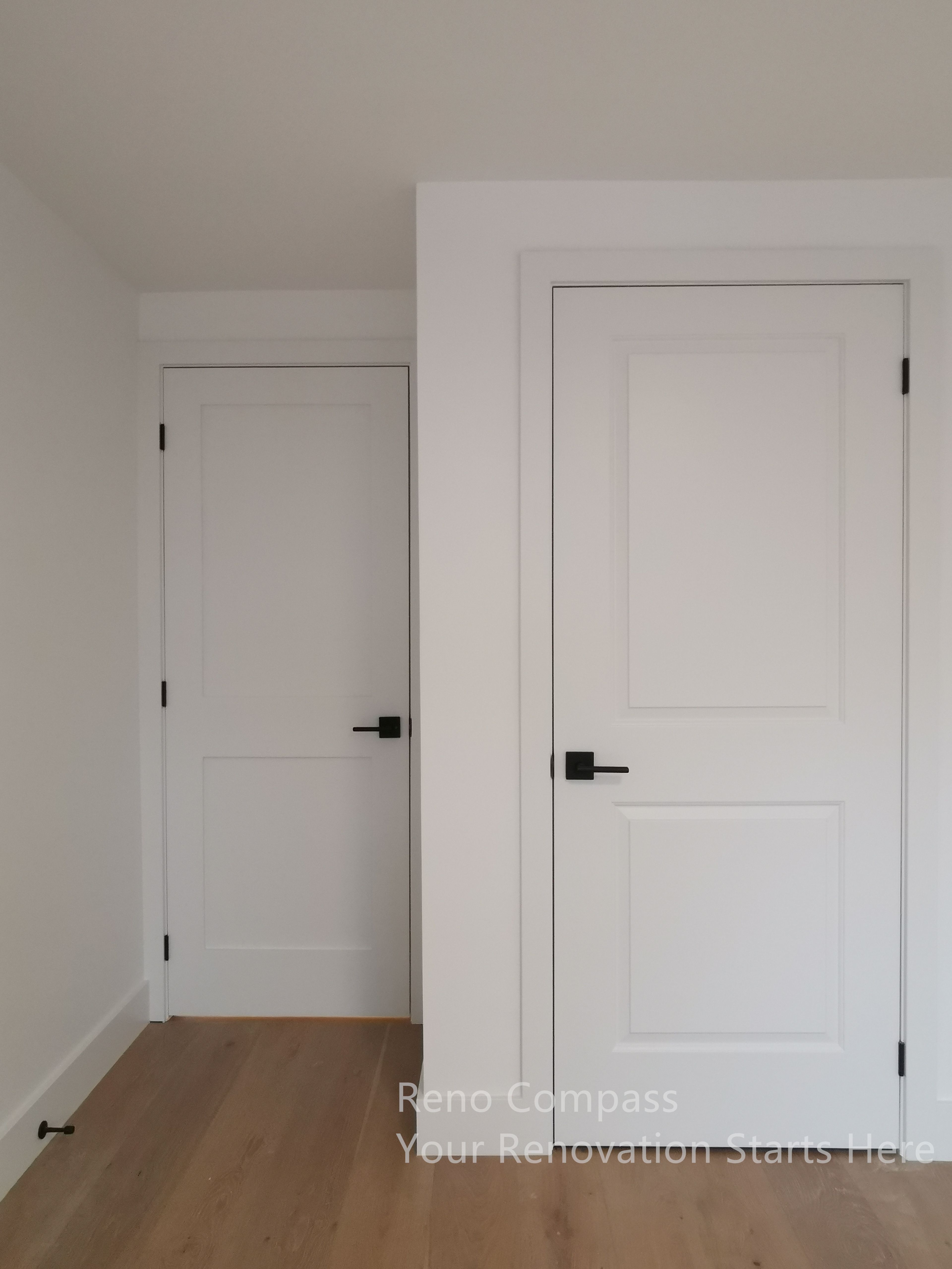 This image showcases clean-lined interior doors completed as part of a Markham interior renovation. The white paneled doors create a timeless and cohesive look, while matte black door handles add subtle contrast and a modern touch. Paired with warm wood flooring and neutral wall tones, the design maintains visual balance and continuity throughout the space. The focus is on simplicity, durability, and everyday functionality, ensuring the interior finishes remain elegant, practical, and suitable for long-term living.