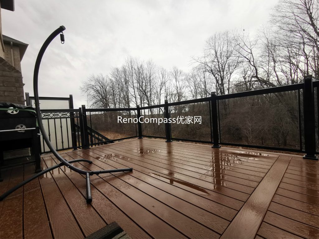 Beautiful backyard deck renovation in Aurora showcasing high-quality composite wood decking, modern black aluminum and glass railings, and a spacious outdoor entertainment area. This professionally built deck enhances outdoor comfort, safety, and property value while creating a stylish and durable outdoor living space.