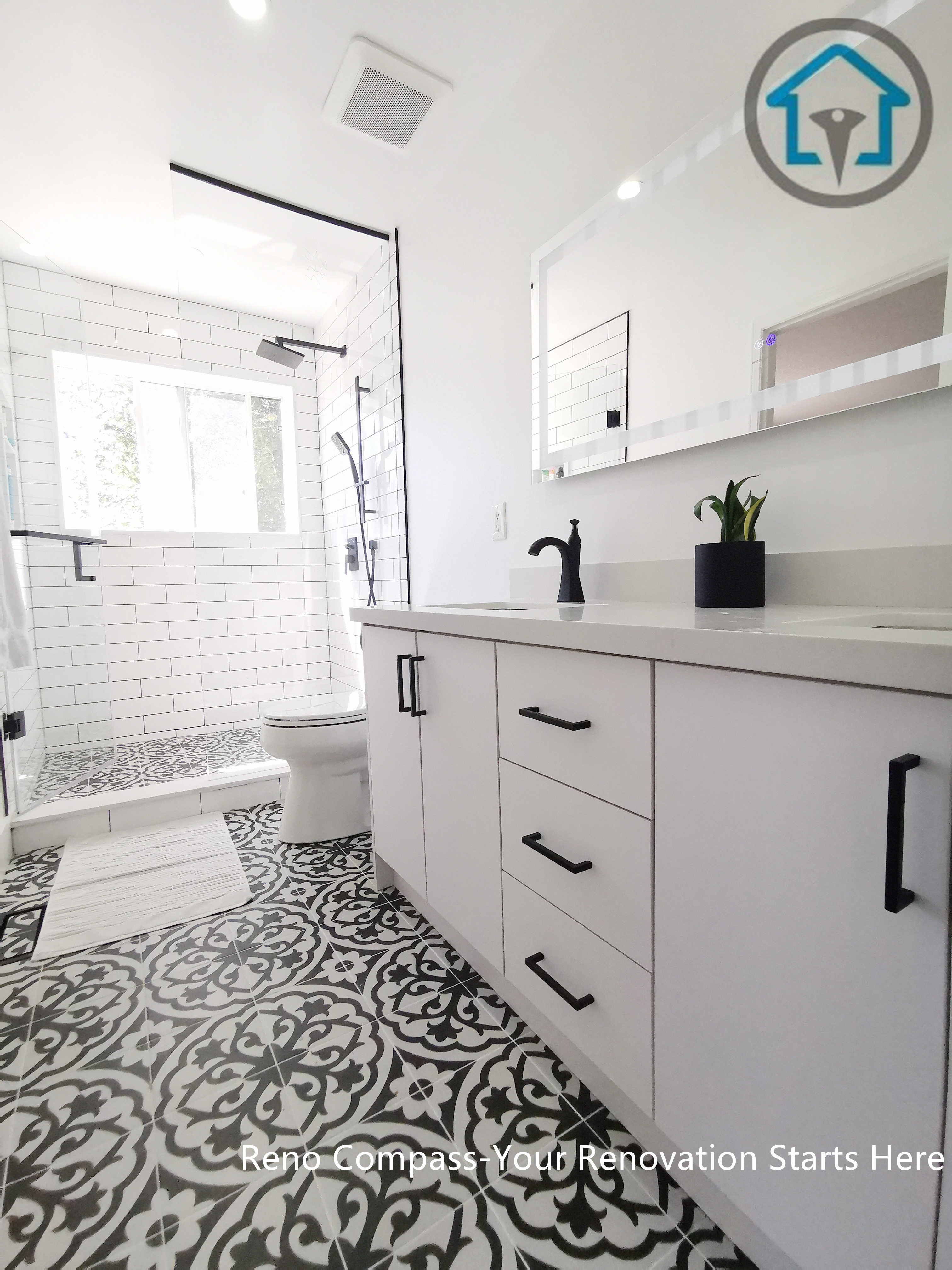 A close-up view of a modern double sink vanity featuring a white quartz countertop, integrated sinks, brass faucets, and an LED backlit mirror. This Ajax bathroom renovation combines clean lines, soft neutral tones, and practical storage for a bright and functional everyday space.