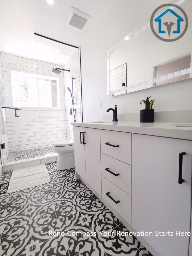 A close-up view of a modern double sink vanity featuring a white quartz countertop, integrated sinks, brass faucets, and an LED backlit mirror. This Ajax bathroom renovation combines clean lines, soft neutral tones, and practical storage for a bright and functional everyday space.