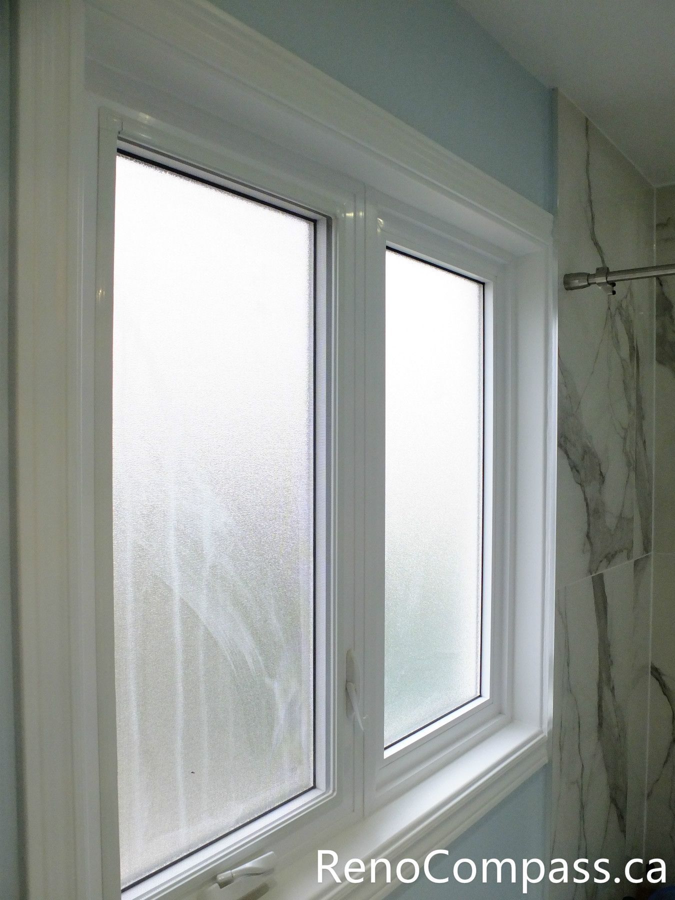 This Richmond Hill bathroom renovation features a newly upgraded window with clean white trim and frosted glass for improved privacy and natural light. Completed by a professional Toronto renovation company, the updated window enhances ventilation, brightness, and overall comfort while complementing the modern bathroom design.