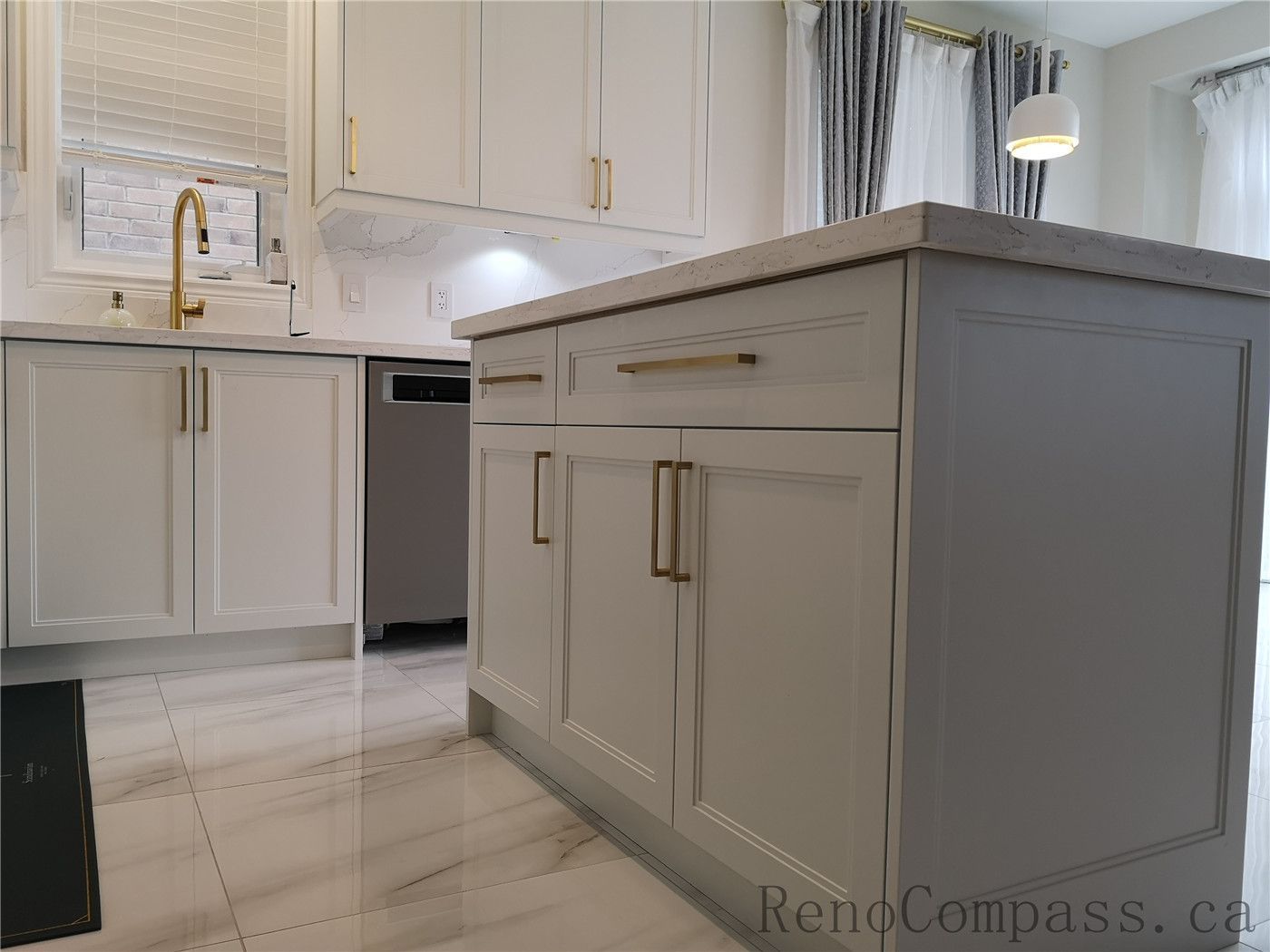 This Aurora kitchen renovation showcases a modern and elegant layout with custom white shaker cabinets, quartz countertops, marble-style backsplash, and stylish brushed gold hardware. Under-cabinet lighting enhances both functionality and ambiance, while the centered window sink design creates a bright and balanced workspace. Completed by a professional Toronto renovation company focused on quality craftsmanship, timeless design, and practical everyday living.