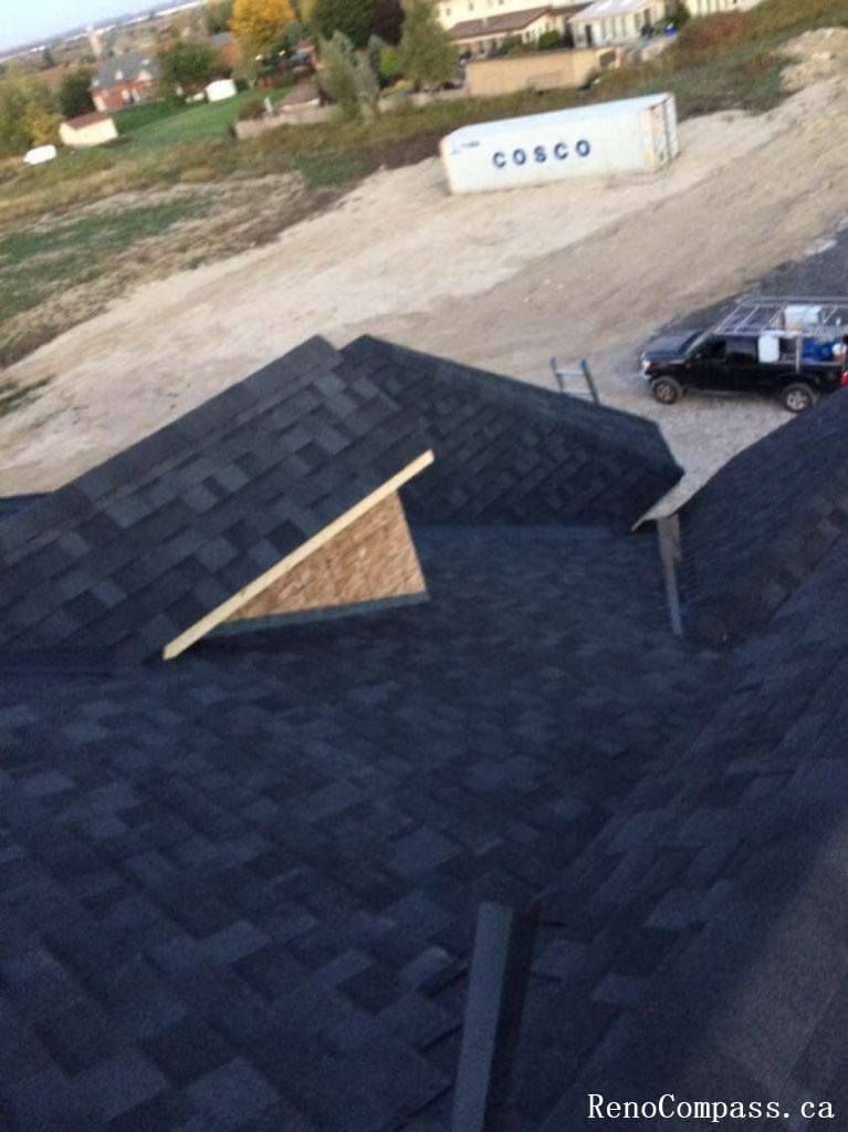 Residential roofing upgrade completed in Richmond Hill with high-quality asphalt shingles and improved ventilation system. The project ensures enhanced insulation, protection against Canadian weather, and a clean, modern roof appearance.