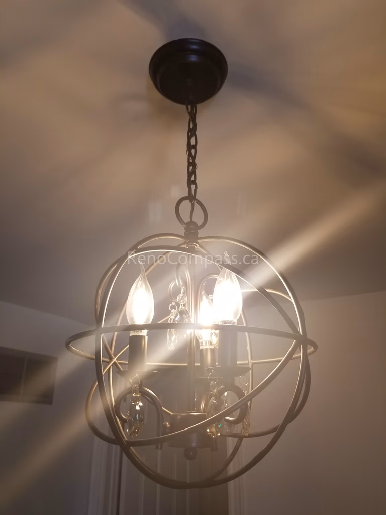This Mississauga interior renovation highlights a stylish modern chandelier installation that enhances the home’s ambiance with warm lighting and contemporary design. The decorative ceiling light fixture adds elegance and character, serving as a focal point that elevates the overall interior atmosphere.

Installed by Reno Compass Inc., this lighting upgrade combines functionality and aesthetic appeal, bringing a sophisticated and welcoming touch to the renovated living space.