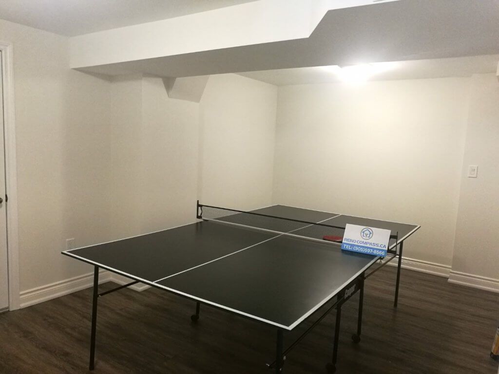 This Markham basement renovation transforms an underused space into a clean and functional multi-purpose entertainment area. The finished basement features durable wood-look flooring, smooth white walls, upgraded lighting, and an open layout suitable for games, family activities, or home recreation. Completed by a professional Toronto renovation company, this basement renovation focuses on comfort, flexibility, and long-term usability for everyday living.