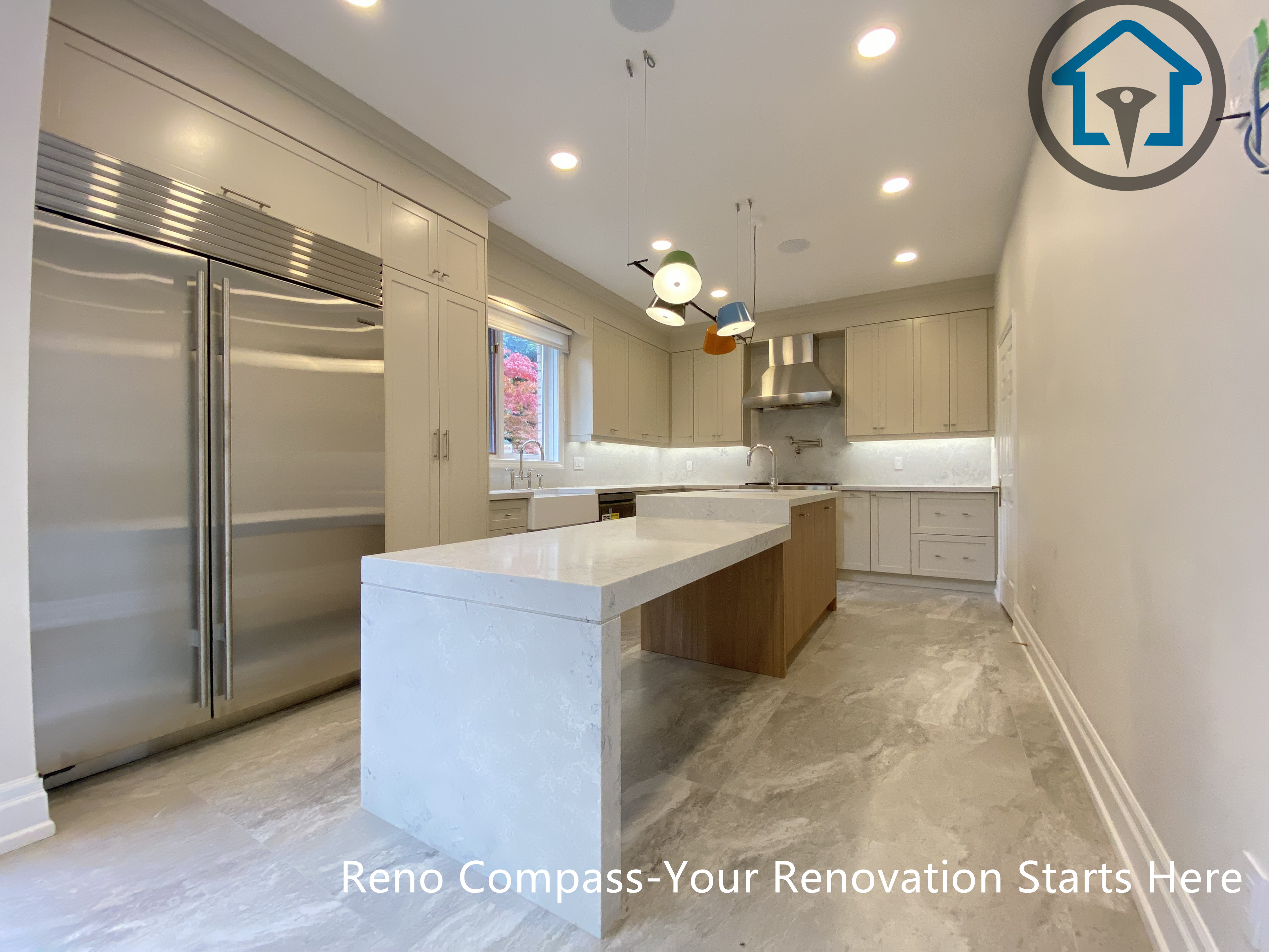 Custom kitchen with island sink, gas range, and tailored cabinetry, completed as part of a Thornhill renovation by Reno Compass.