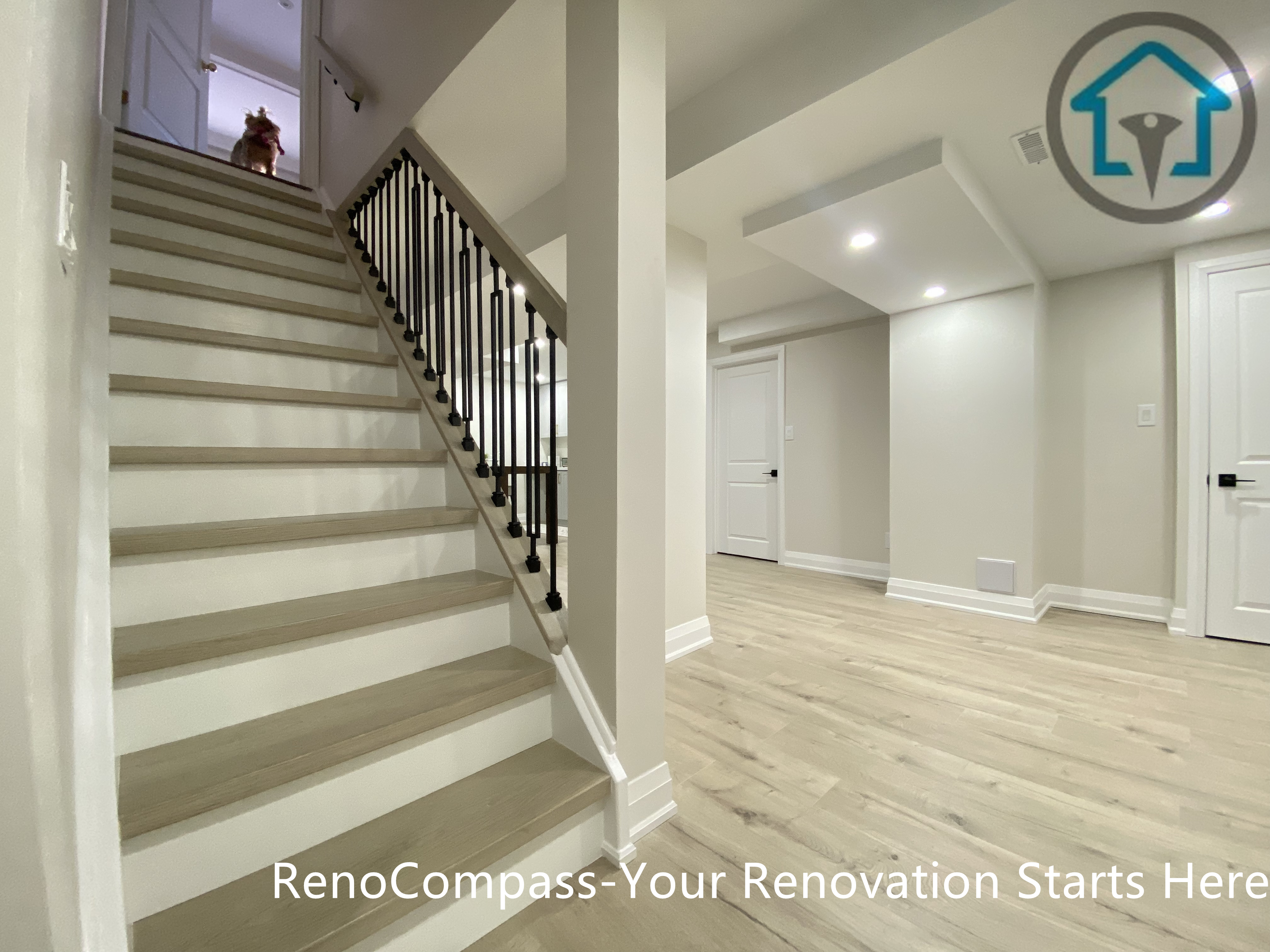 本项目地下室楼梯及地面工程由 Reno Compass 施工团队 完成整体翻新。楼梯采用实木踏步搭配黑色金属护栏，在保证结构安全的同时提升空间的现代感与通透度。地下室地面统一铺设浅色木纹地板，与楼梯材质自然衔接，使上下楼层在视觉与动线上保持一致。整体设计有效改善地下室入口区域的采光与层次感，为后续娱乐区与生活空间提供良好的基础过渡。