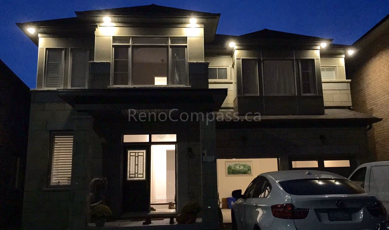 Professional outdoor spotlight installation in Aurora, featuring modern LED exterior lighting that enhances architectural details, improves nighttime visibility, and elevates curb appeal. Completed by a trusted Toronto renovation company, Reno Compass Inc., specializing in exterior lighting design and installation for luxury residential homes.