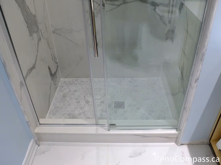 This Richmond Hill bathroom renovation features durable and stylish floor tile installation designed for long-term performance and easy maintenance. Completed by a professional Toronto renovation company, the upgraded flooring enhances both safety and modern visual appeal while complementing the overall bathroom design.