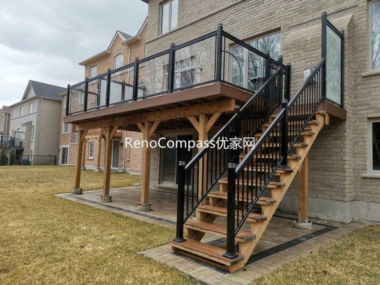 Custom backyard renovation in Aurora featuring solid wood deck stairs, modern railing installation, and professionally installed interlocking patio flooring. This outdoor upgrade enhances accessibility, durability, and overall backyard functionality while creating a clean and stylish landscape design.