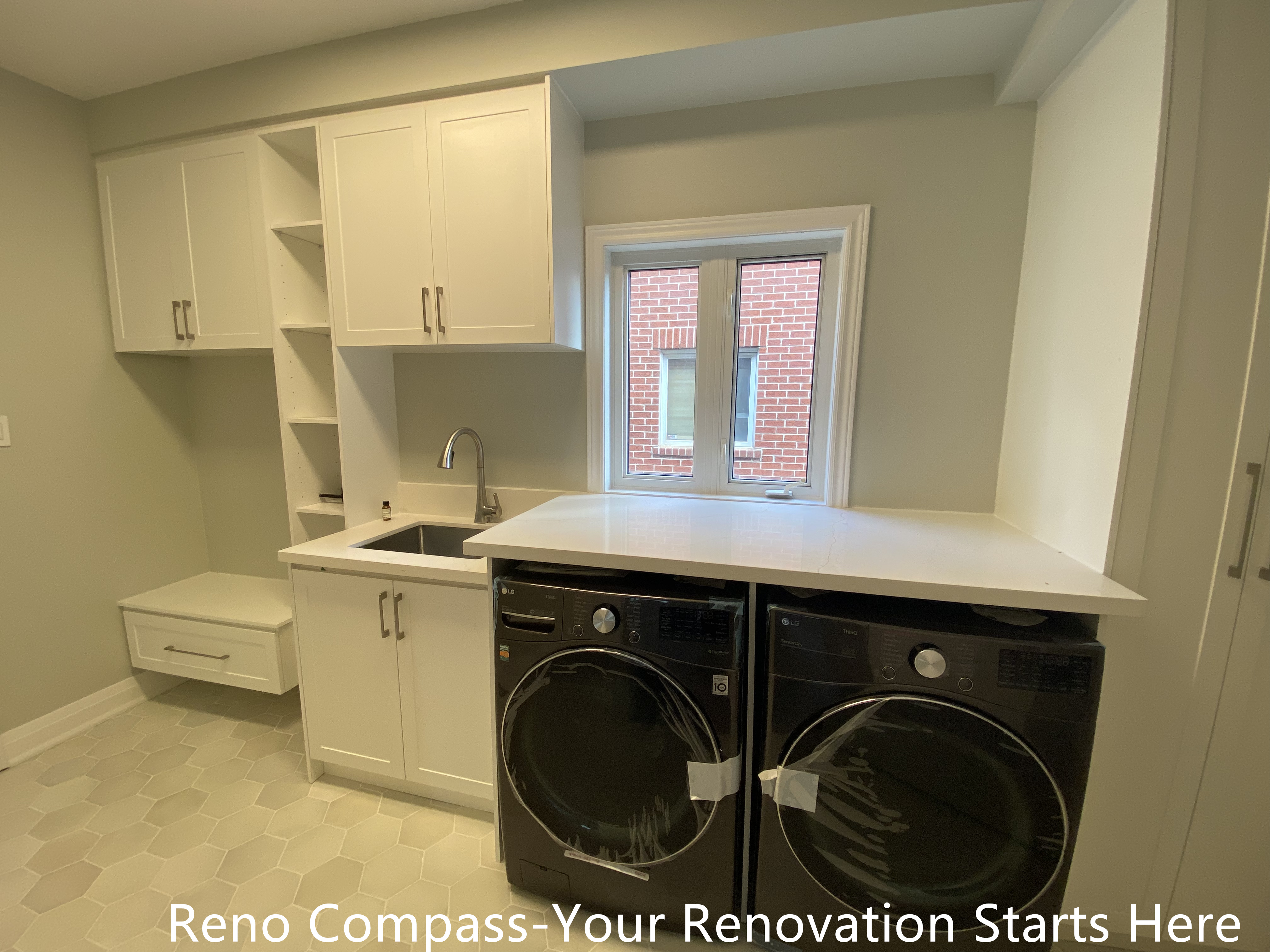 Compact bathroom vanity design in an Oakville interior renovation, showcasing efficient layout, floating wood-finish cabinetry, and contemporary lighting. This renovation focuses on maximizing space while maintaining a clean, modern aesthetic completed by a professional Toronto renovation company.