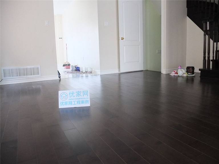 This image features the completed bedroom flooring installation as part of a whole house flooring project in Markham. Dark hardwood flooring is installed with consistent plank alignment and clean baseboard detailing, creating a calm, modern, and unified interior space. The smooth finish and rich wood tone enhance the room’s comfort and durability, reflecting professional residential flooring installation services in the Greater Toronto Area.