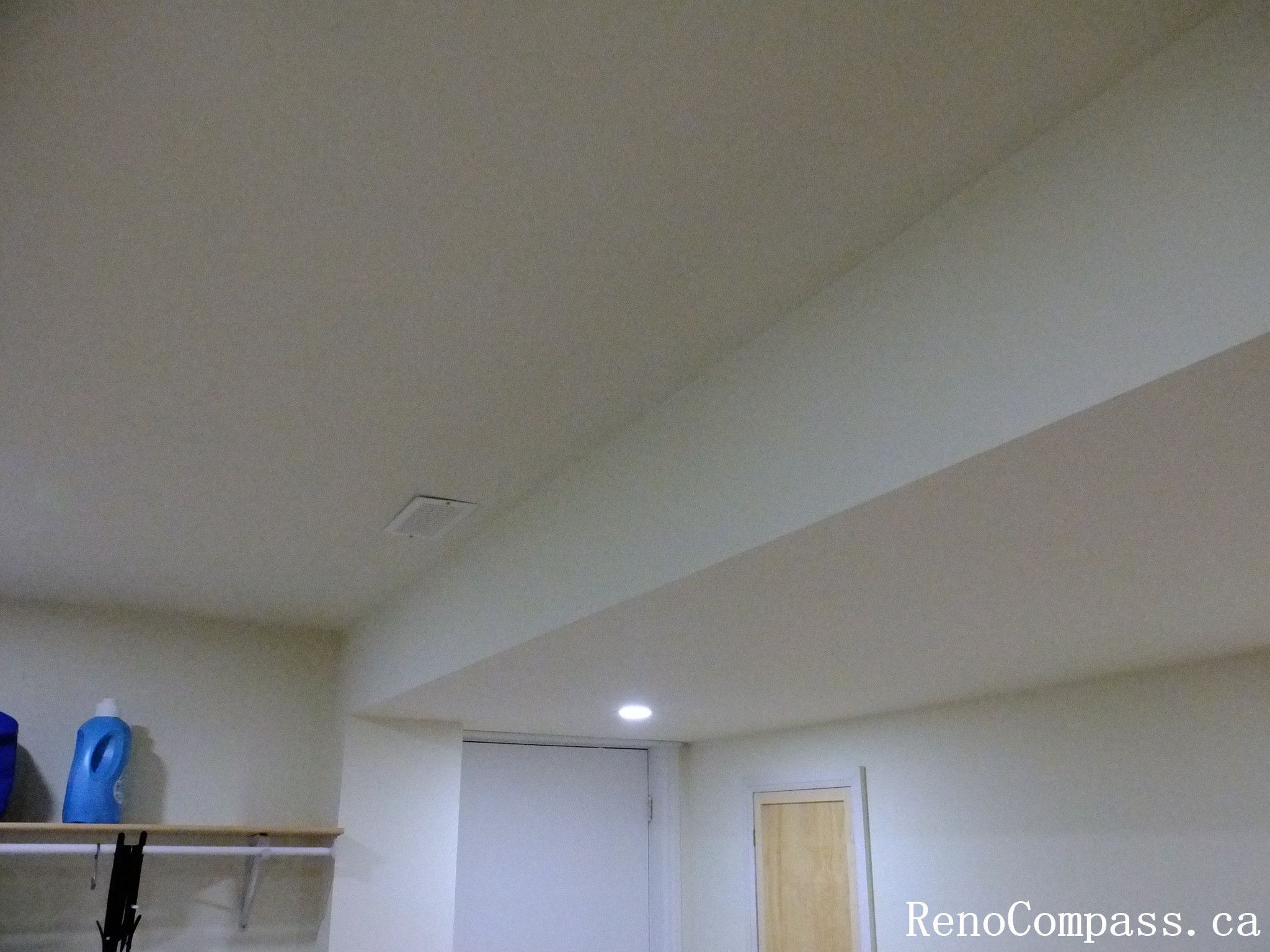 This Richmond Hill interior renovation highlights a clean and professionally finished basement ceiling with recessed lighting and smooth drywall work. The upgraded ceiling design improves brightness and creates a more open, modern feel throughout the space. Fresh neutral wall colors and updated lighting enhance the overall comfort and functionality of the basement area. Completed by an experienced Toronto renovation company, this project demonstrates attention to detail in structural finishing, lighting installation, and modern interior improvements for a polished residential living space.