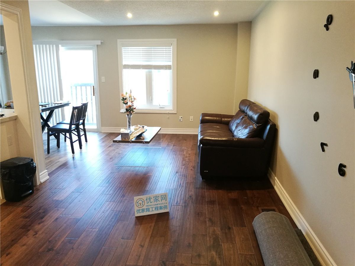 Completed interior renovation project in Richmond Hill and Markham featuring hardwood flooring, modern lighting, and open-concept living design, completed by Toronto renovation company Reno Compass Inc.