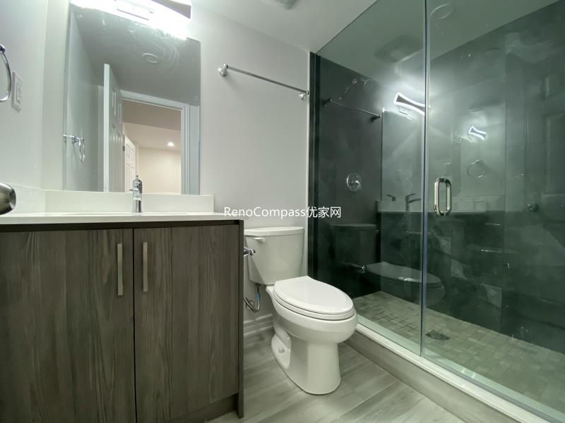 Modern basement bathroom renovation in Richmond Hill featuring a sleek glass shower enclosure, contemporary vanity, and upgraded tile finishes. Completed by a professional Toronto renovation company, this finished basement bathroom combines durability, functionality, and clean modern design to enhance comfort and everyday usability.