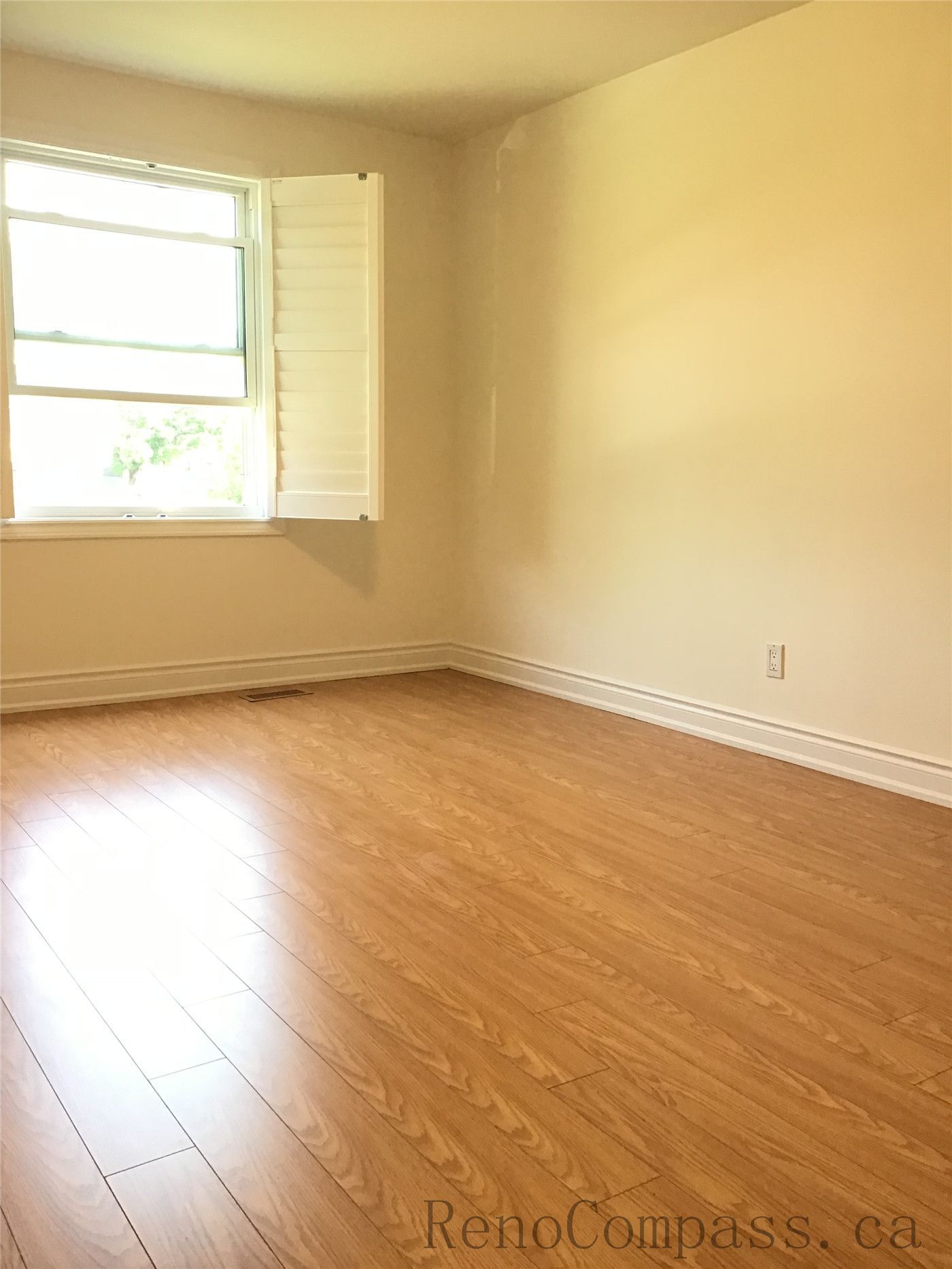 This image showcases a completed interior flooring renovation in Oakville, featuring high-quality warm-tone hardwood flooring. The smooth finish, natural wood grain, and clean installation create a bright and inviting living space, enhancing both comfort and overall home value.