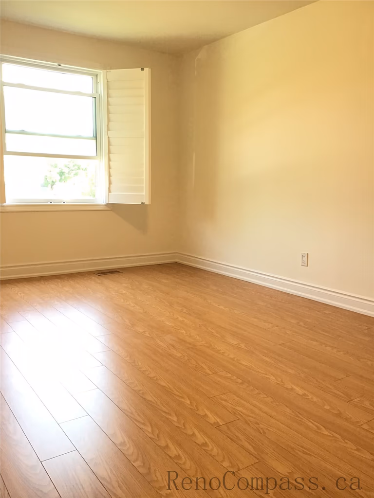 This image showcases a completed interior flooring renovation in Oakville, featuring high-quality warm-tone hardwood flooring. The smooth finish, natural wood grain, and clean installation create a bright and inviting living space, enhancing both comfort and overall home value.