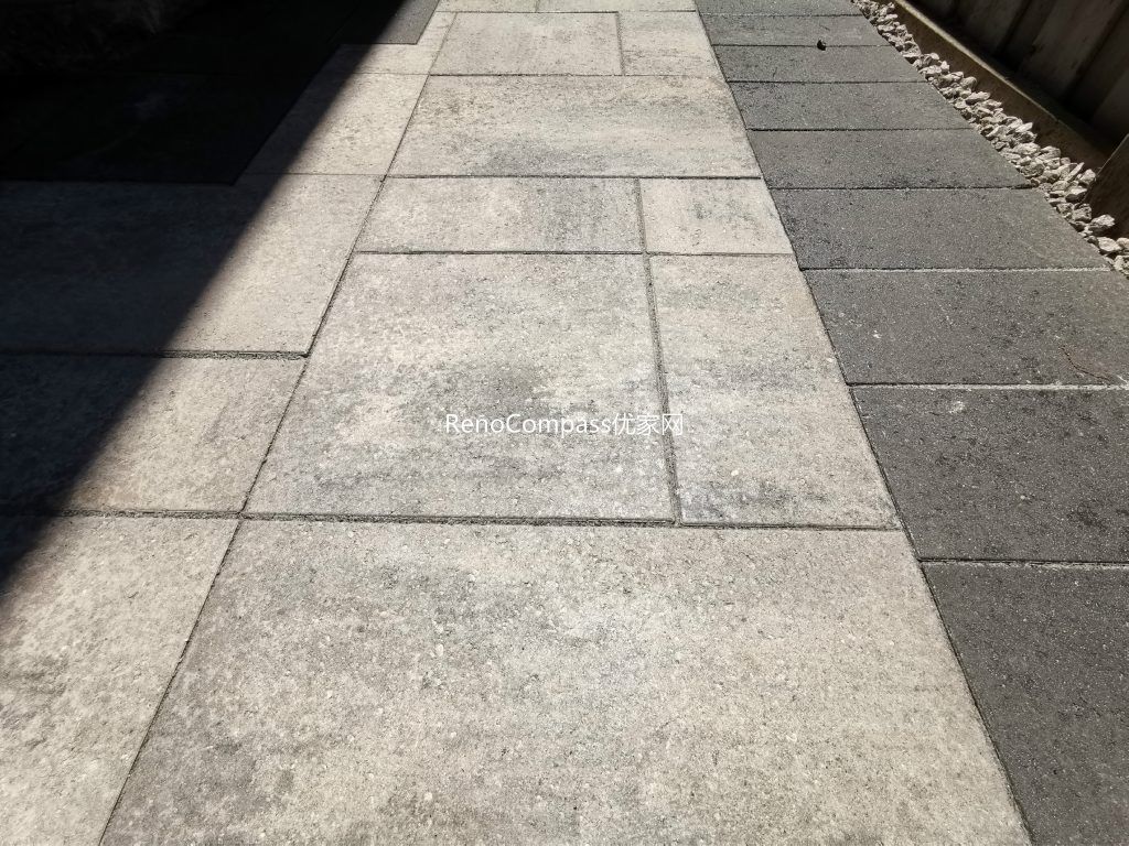 Modern interlocking walkway installation in Mississauga featuring large-format patio stones with contrasting border accents. This durable and low-maintenance paving design improves outdoor accessibility, drainage, and curb appeal while creating a clean and contemporary pathway for everyday use.