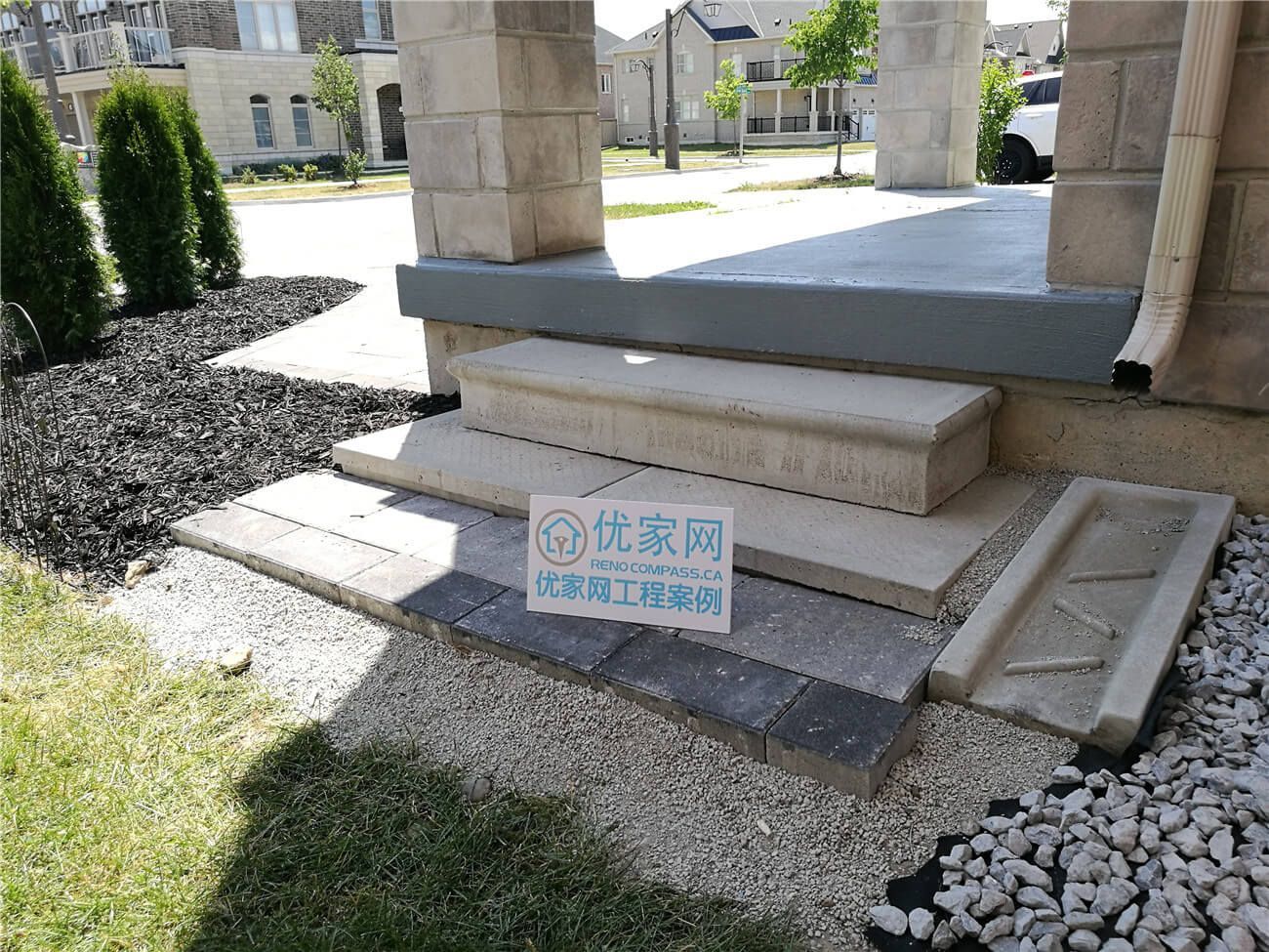 This Stouffville landscaping renovation showcases a front entrance upgrade featuring newly installed stone steps, interlock edging, and decorative gravel landscaping. The refreshed entryway improves safety, drainage, and curb appeal while creating a clean transition between the porch, walkway, and garden areas. Designed and completed by a professional Toronto landscaping and renovation contractor, the project enhances both functionality and visual balance for this modern residential home exterior.