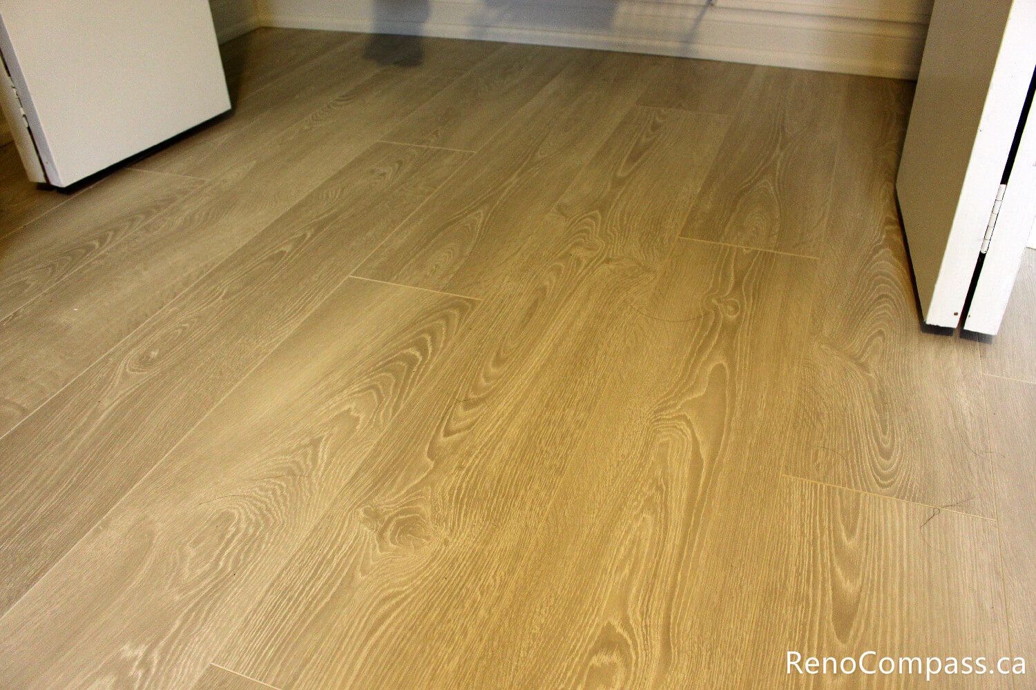 A detailed look at professional baseboard finishing and wide-plank flooring installation for an Oshawa interior renovation. Reno Compass specializes in clean lines and high-quality trim work to provide a polished look for any room in your home.