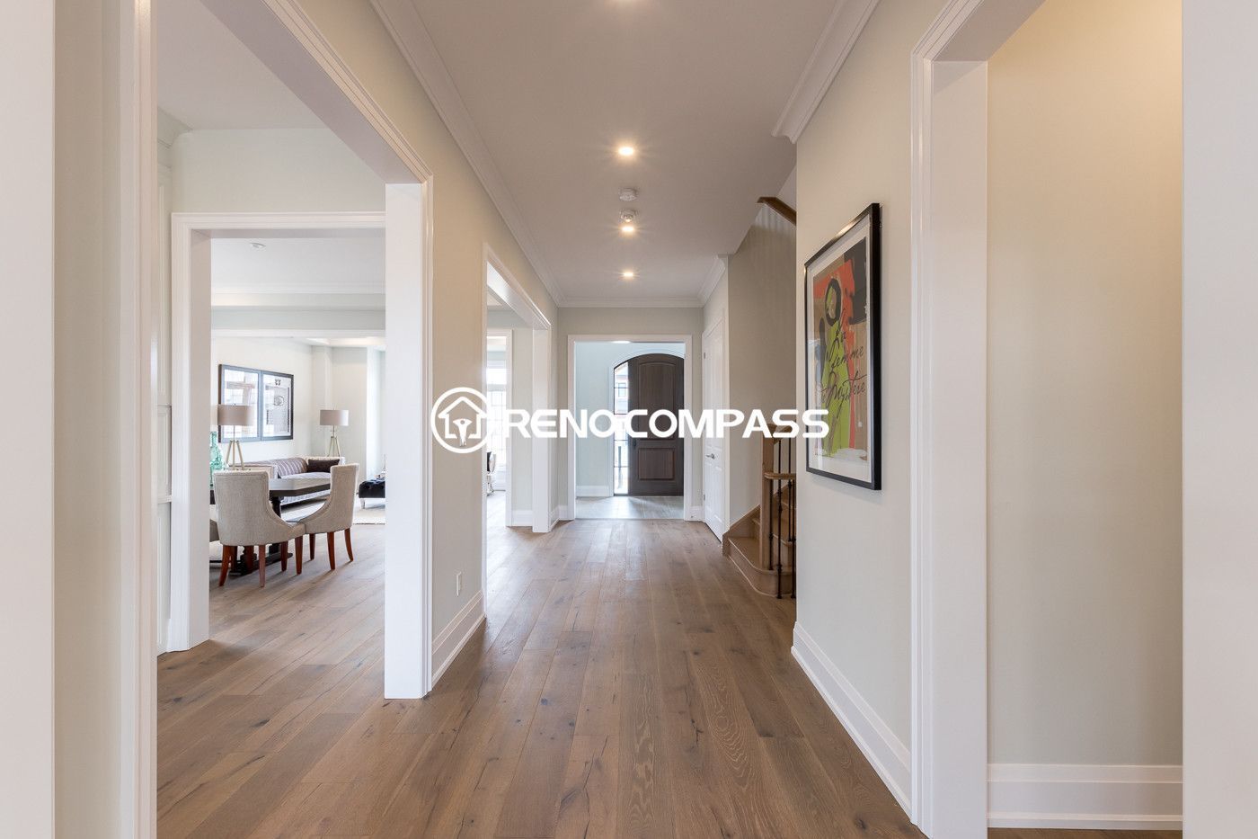 This image shows a Newmarket home flooring renovation project, featuring professionally installed engineered wood flooring throughout the hallway and living space. Engineered wood flooring offers the natural look of hardwood with improved stability and durability.

The flooring upgrade creates a clean and modern interior and was completed by Reno Compass Inc., a Toronto renovation company specializing in flooring and interior renovations.