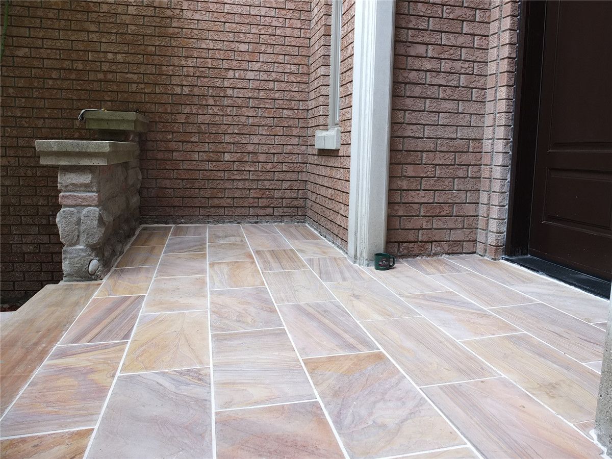 This Richmond Hill front entrance renovation showcases a newly installed interlocking stone porch with durable natural-tone tiles and clean modern finishing. The upgraded entrance landing improves safety, drainage, and curb appeal while complementing the home’s brick exterior and stone pillars. Completed by a trusted Toronto renovation company, this landscaping and interlocking project delivers a refined, long-lasting front entry designed for both functionality and visual impact