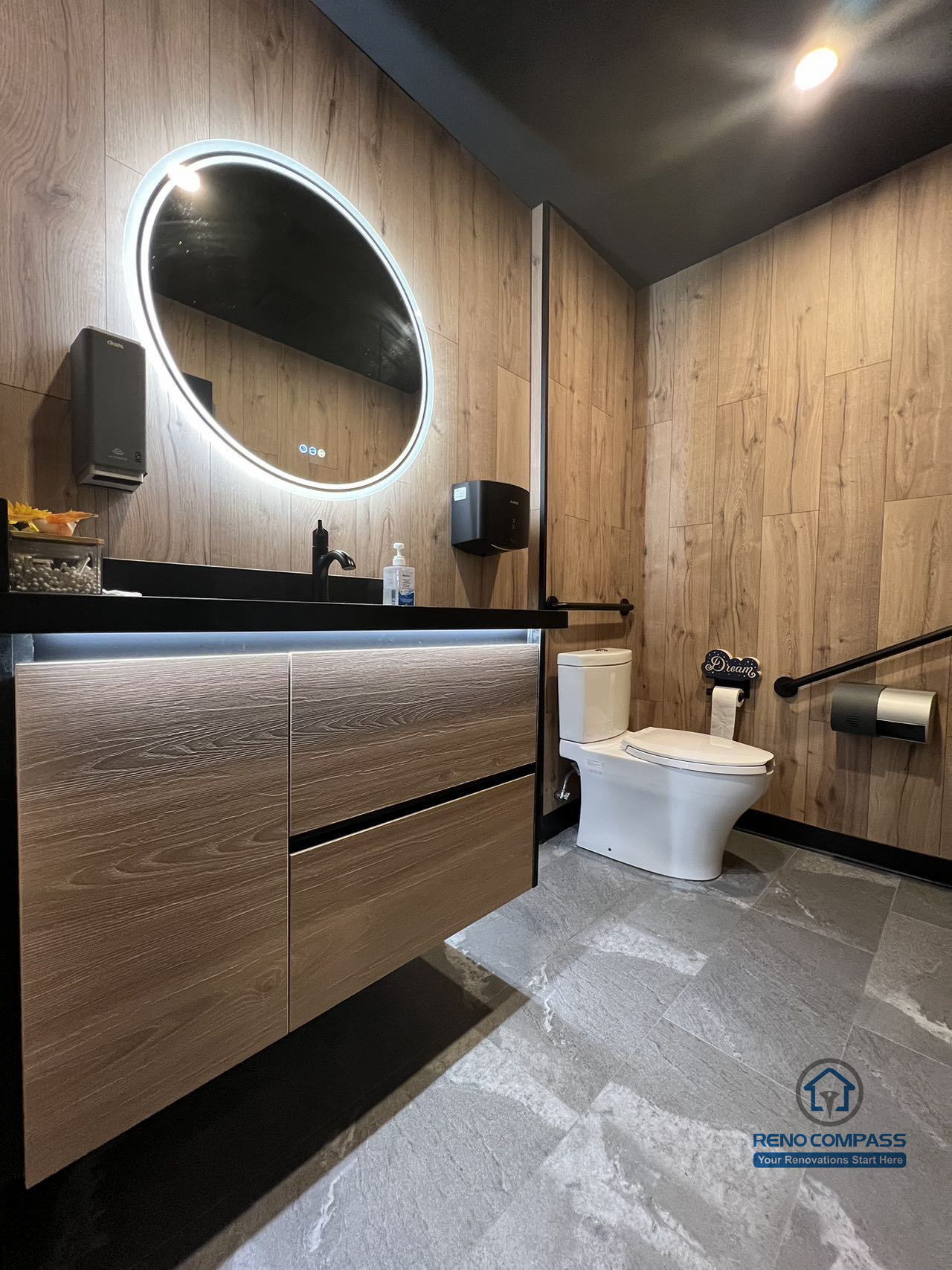 This Mississauga restaurant renovation includes a modern commercial washroom with durable finishes, custom vanity cabinetry, and integrated lighting. The design focuses on easy maintenance, long-term durability, and a clean, professional appearance suitable for high-traffic restaurant use.