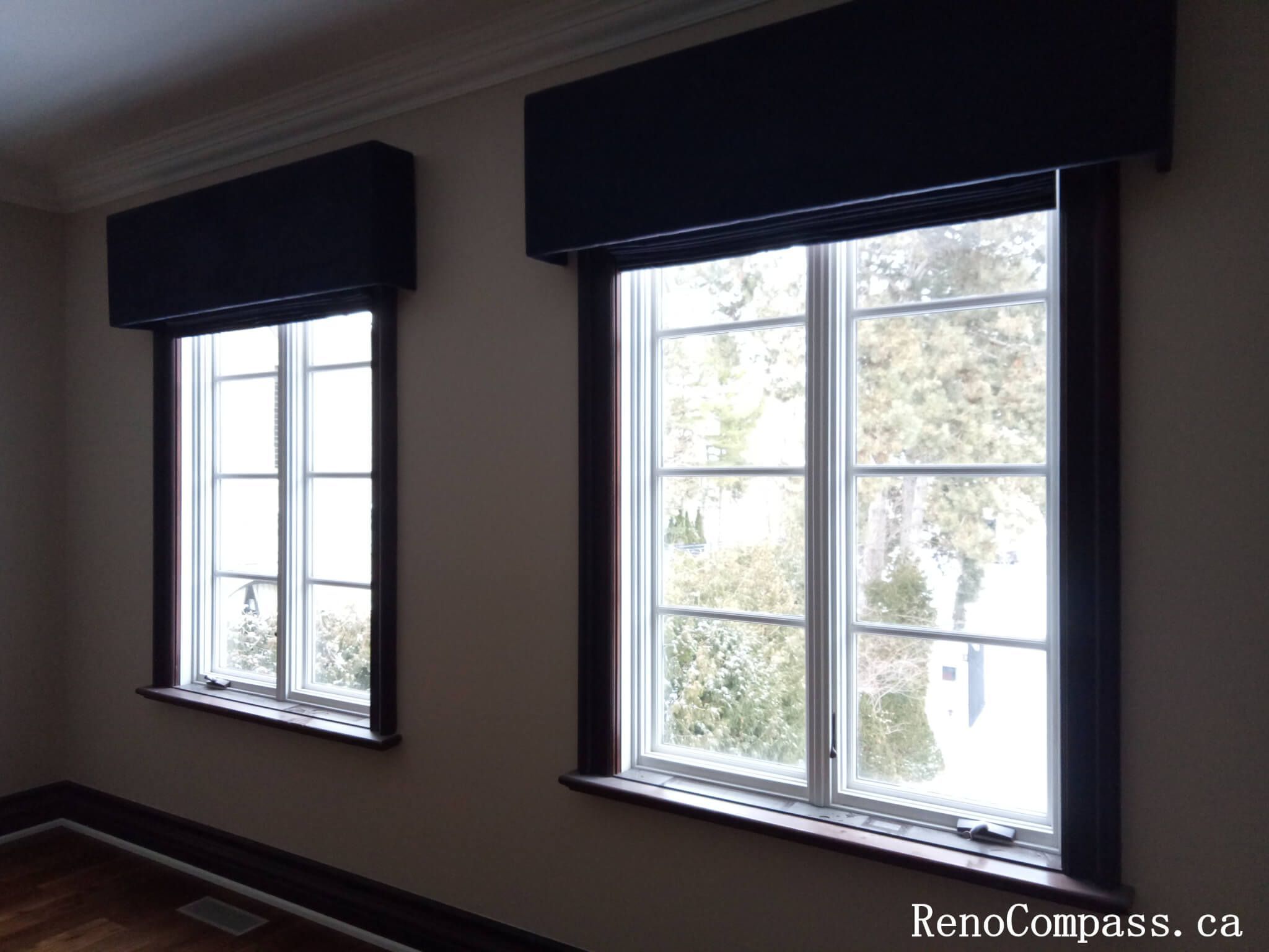 This image captures a completed interior painting project in North York, focusing on freshly painted walls around large windows with crisp trim and crown molding. The neutral wall color enhances natural daylight, creating a bright and comfortable interior atmosphere while maintaining a clean, elegant look. Precise paint application around window frames, baseboards, and ceiling lines reflects careful craftsmanship and professional finishing. This North York painting project highlights attention to detail and balanced color coordination, ideal for bedrooms, living areas, or home offices.