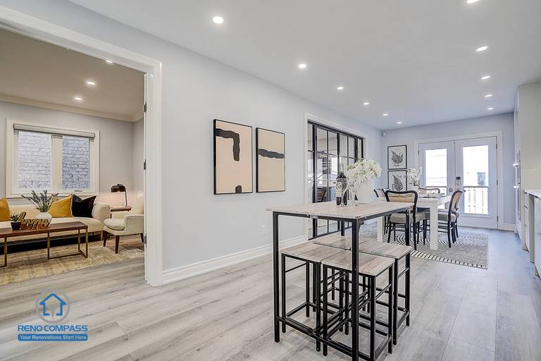 New flooring installation in Vaughan interior renovation project, featuring grey tone wood flooring that creates a clean and unified look.